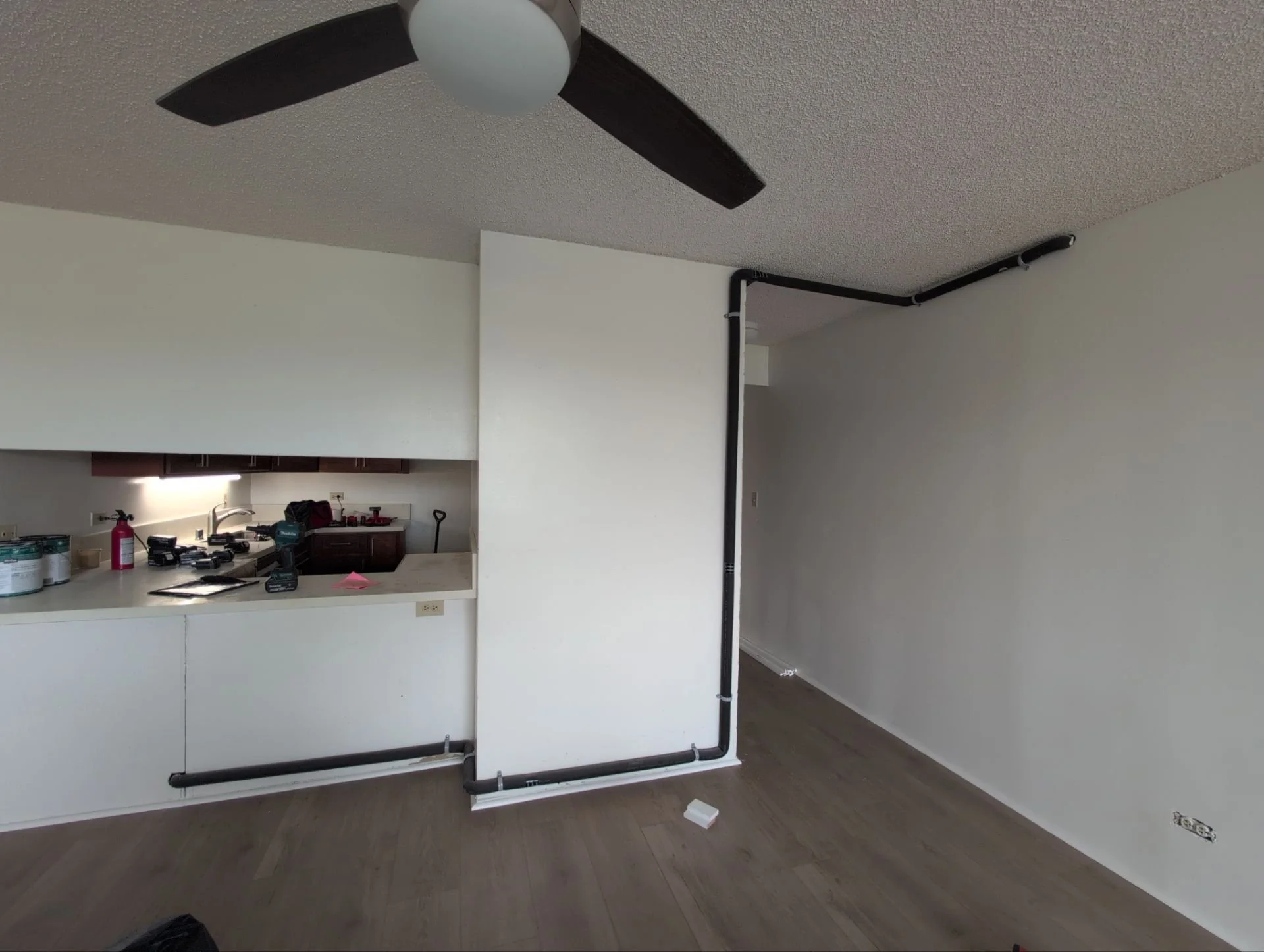 Gave this exposed plumbing a decorative makeover using various trim wood plus 2 coats of color-matched paint