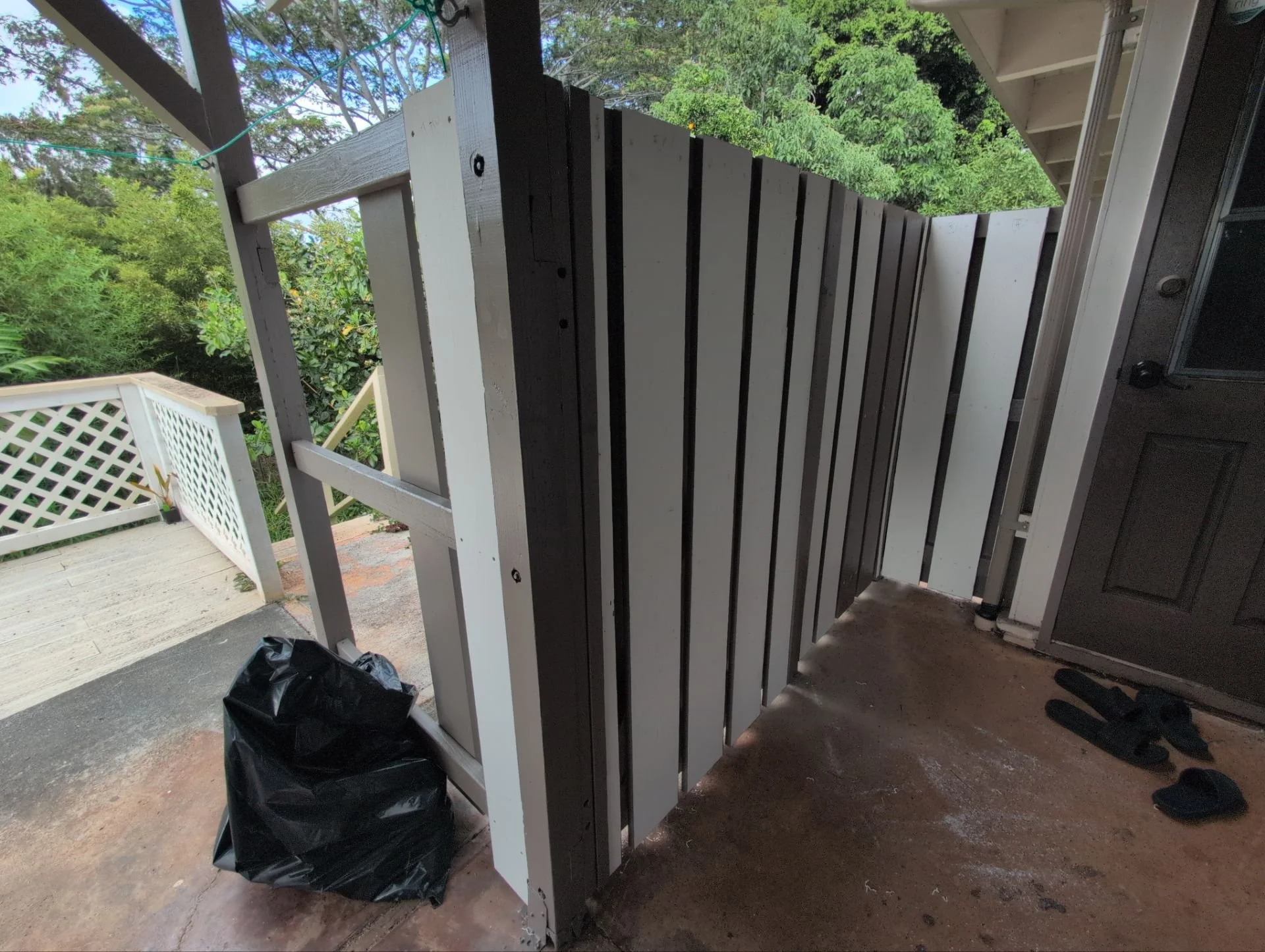 Wooden fence rebuilt using pressure treated lumber, PVC slats / top cap, plus primer & 2 coats of paint