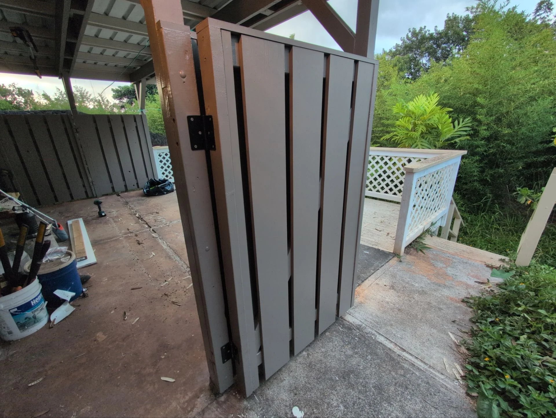 Wooden fence rebuilt using pressure treated lumber, PVC slats / top cap, plus primer & 2 coats of paint