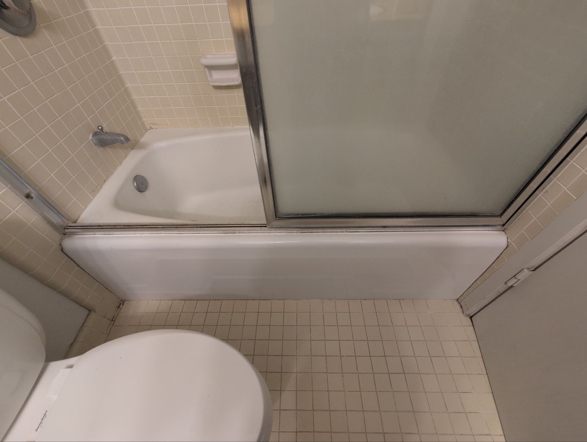 Work at this unit included replacing smoke detectors, repairing a sliding door latch, and a bathtub/shower re-caulk
