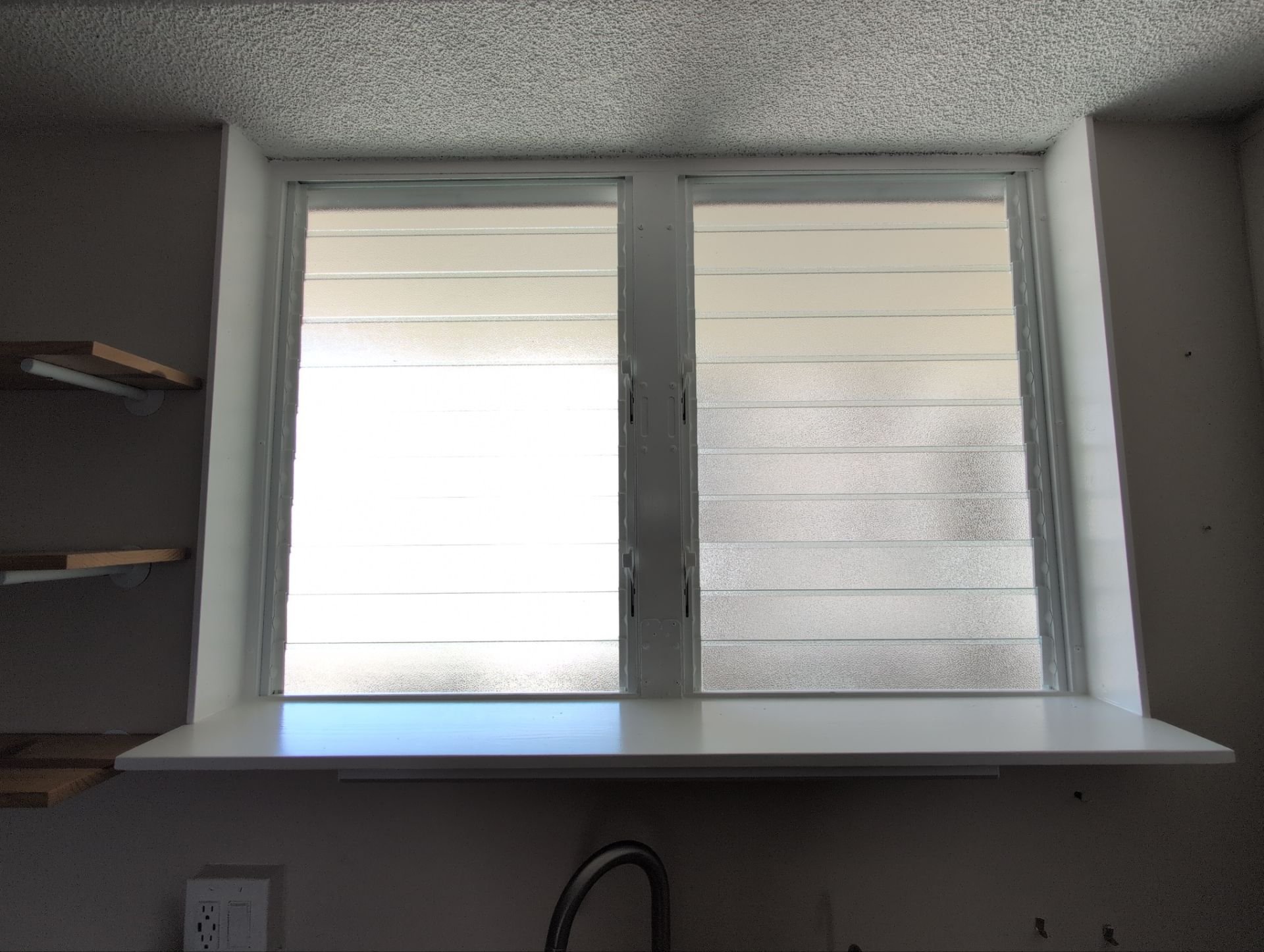 Palmair jalousie window retrofit for this condo in Waikiki