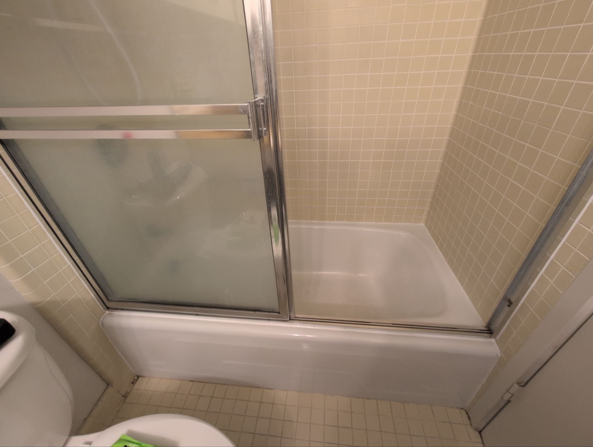 Work at this unit included replacing smoke detectors, repairing a sliding door latch, and a bathtub/shower re-caulk