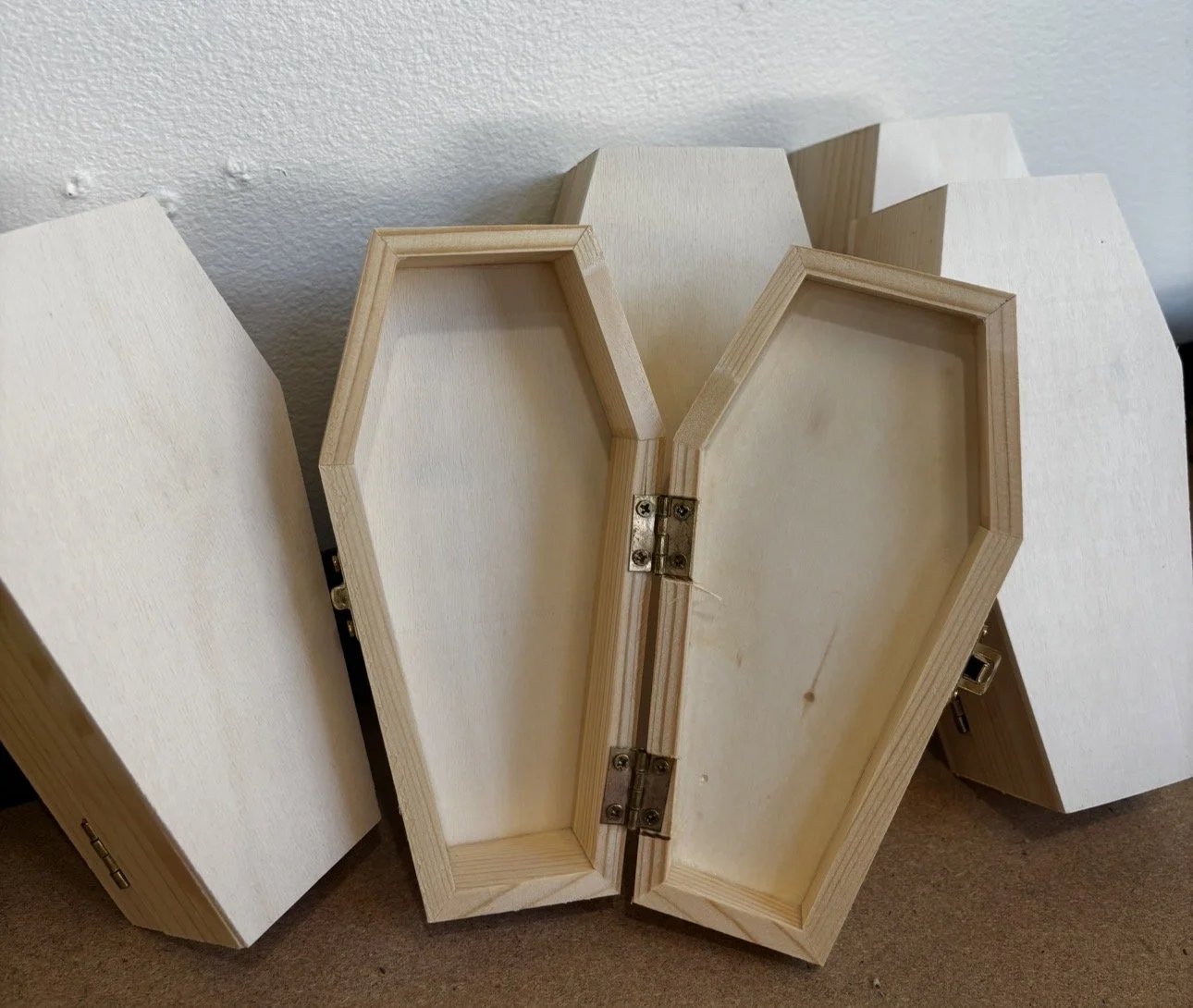 Loadable wooden coffin