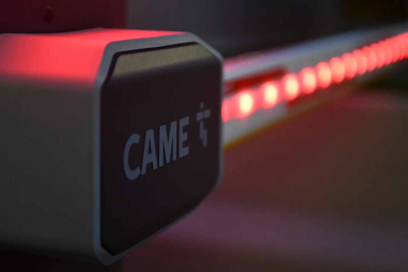 Close-up of a keyboard with a key that says "CAME T" and backlit red LEDs along the side.