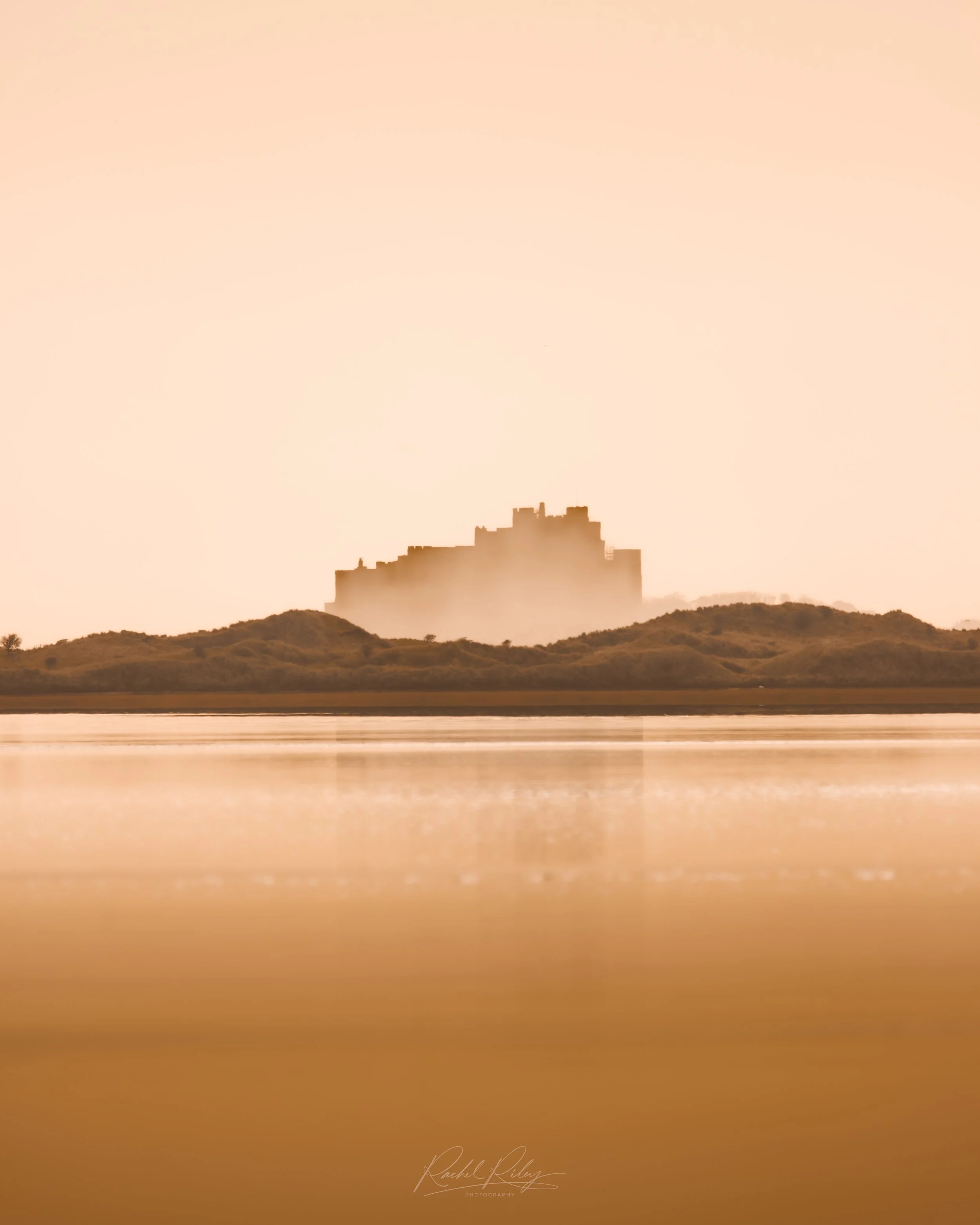 Bamburgh Castle from Holy Island, Northumberland, UK