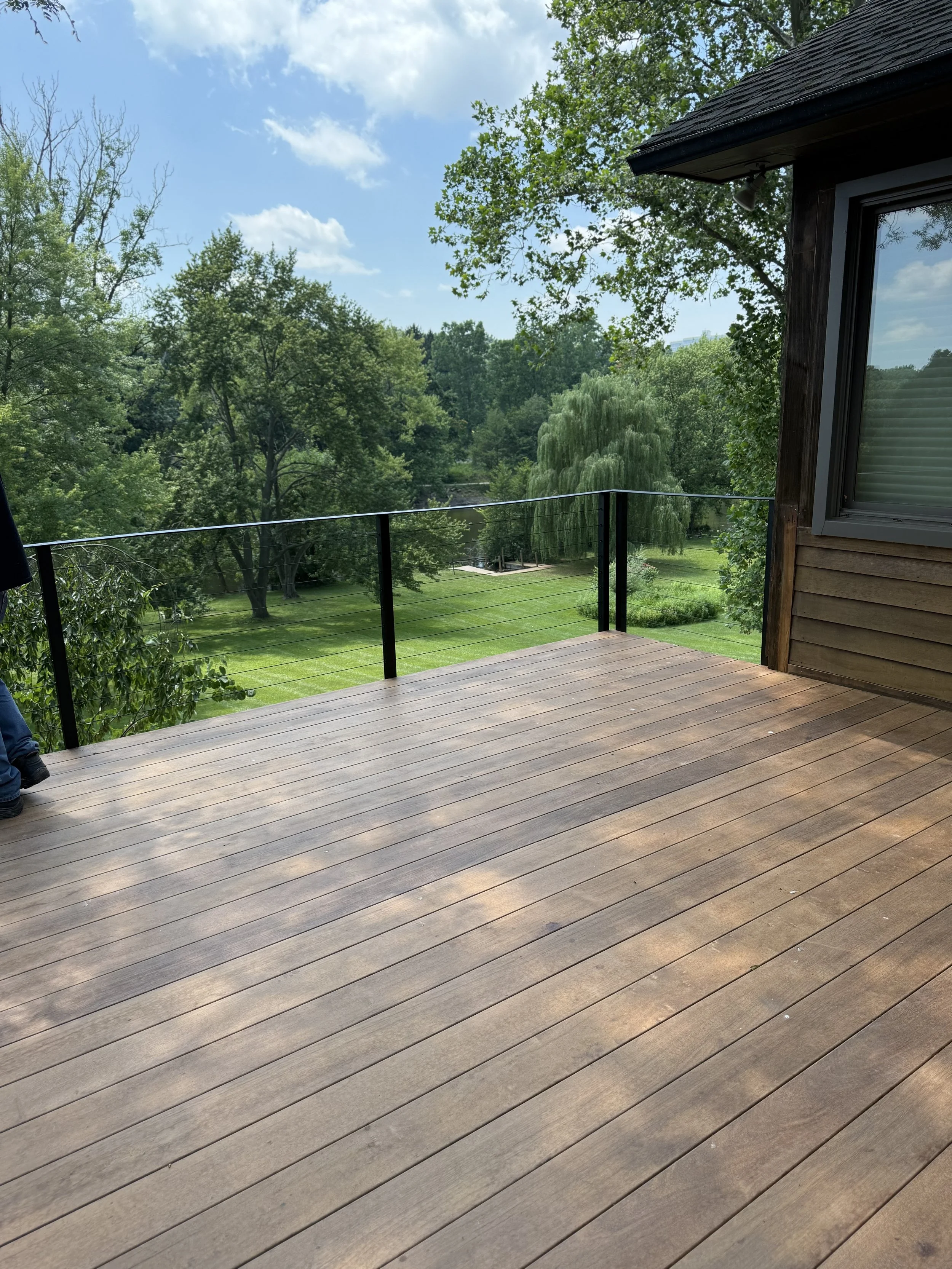 Wooden deck with black railing