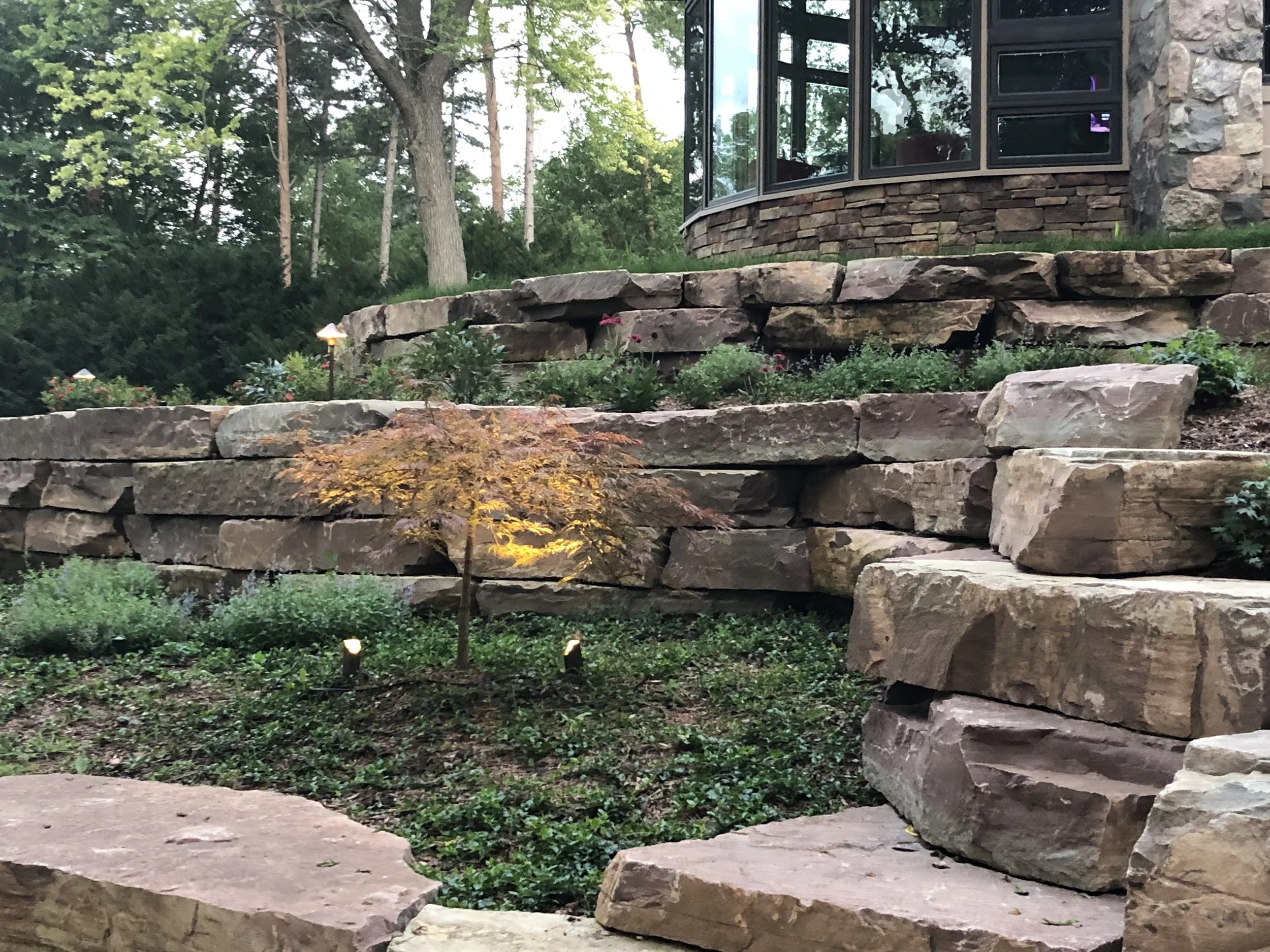 Large boulder retaining walls with ground cover