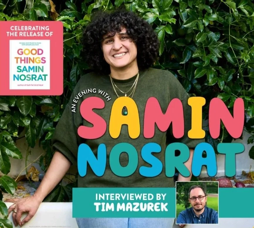 Book cover titled 'An Evening with Samin Nosrat' featuring a woman with curly black hair smiling, standing in front of green leafy plants. A pink box in the top left corner states 'Celebrating the release of Good Things by Samin Nosrat.' A small photo of a man with glasses in a blue shirt is at the bottom right.