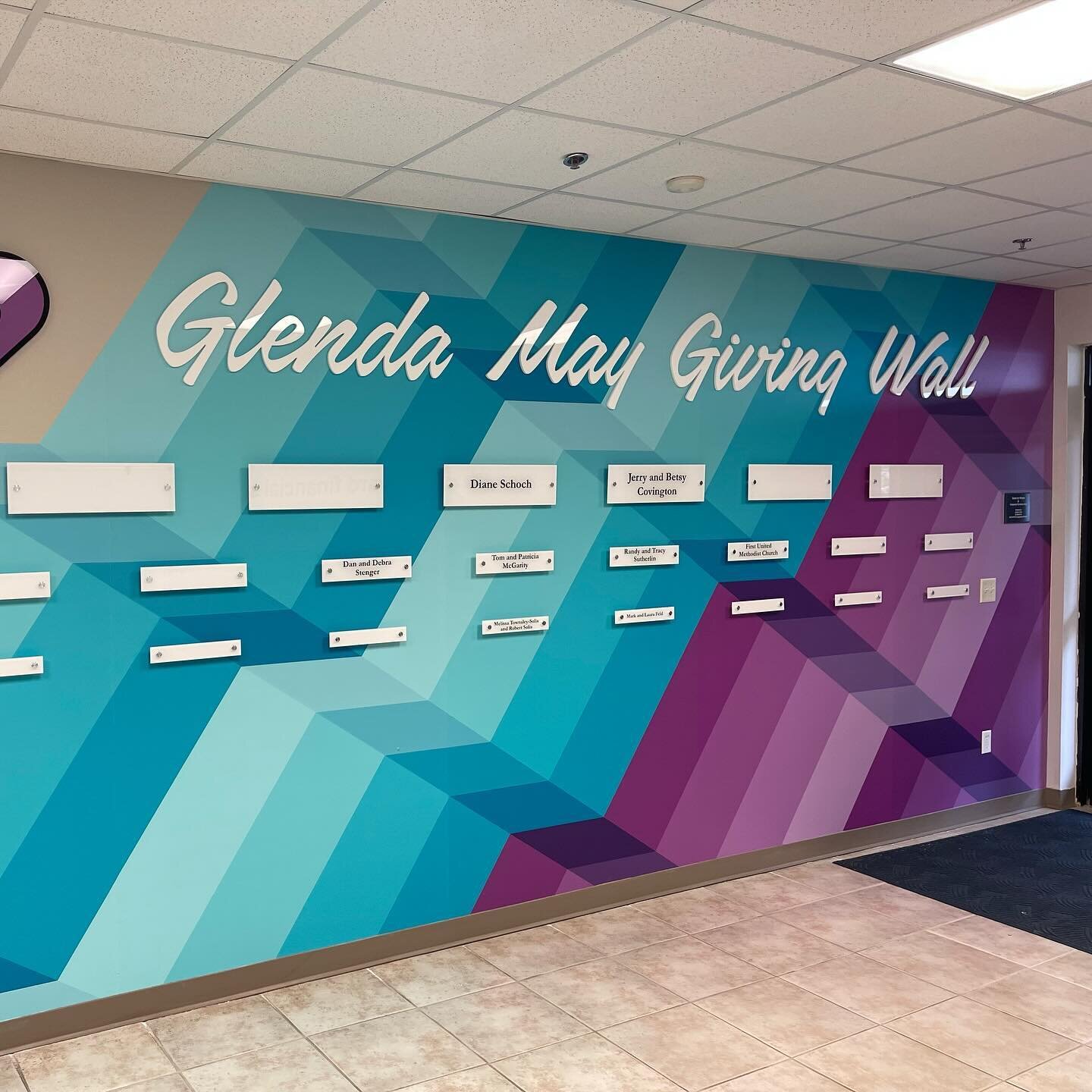 Transforming spaces again at The Graphic Company. This was a beautiful addition to this meeting area. This was done with a wall mural as the base graphic with reverse printed acrylic pieces on top. Give us a call when you are ready for your next tran