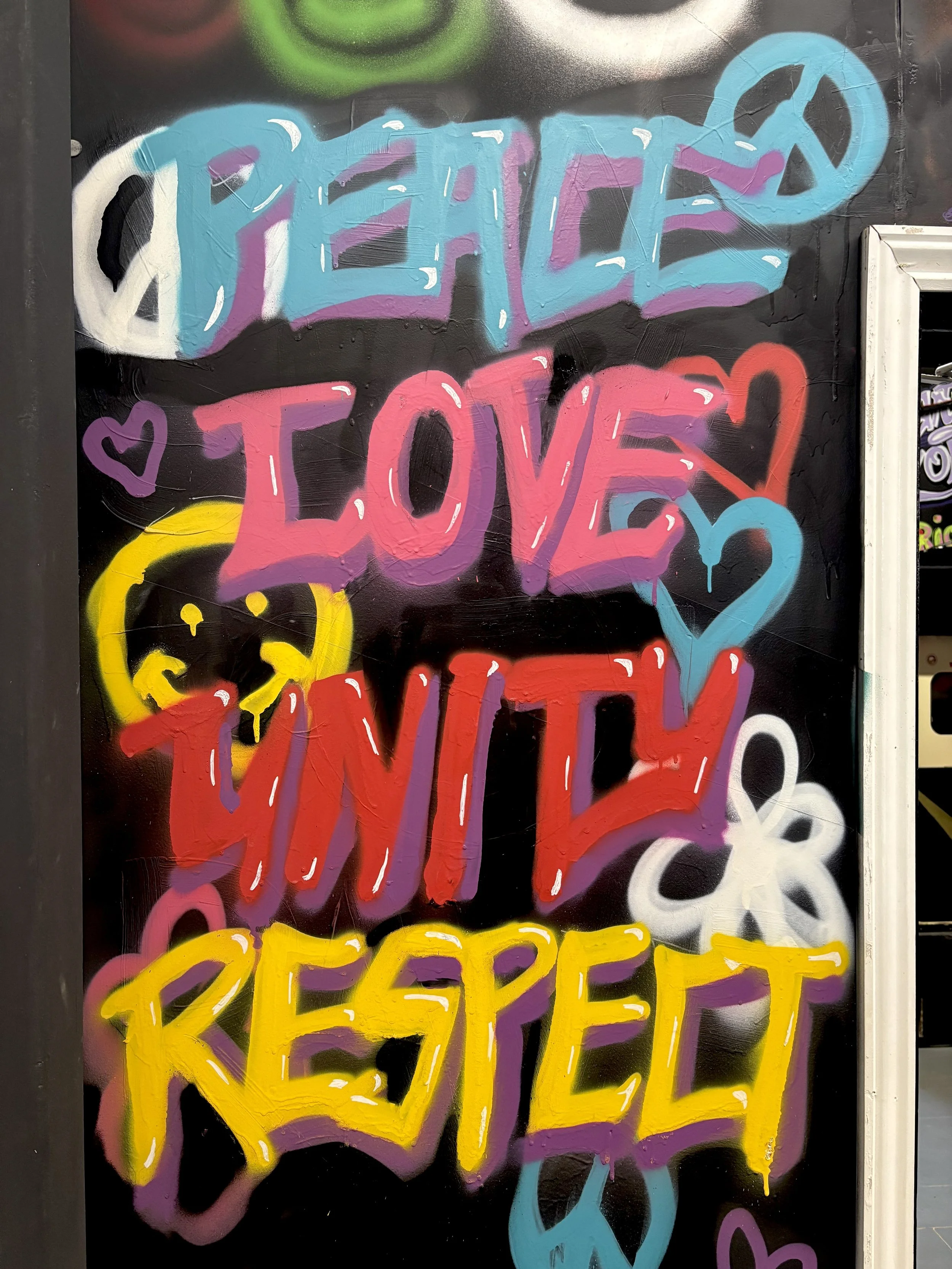 Spray paint mural for Raver Quest escape room entry way - Pier Pressure 2025