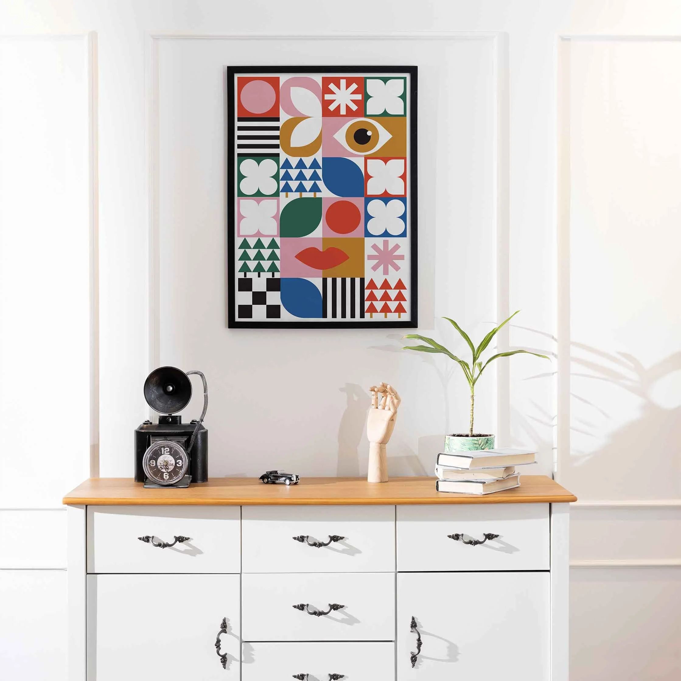 Colorful abstract art print hung on a white wall.