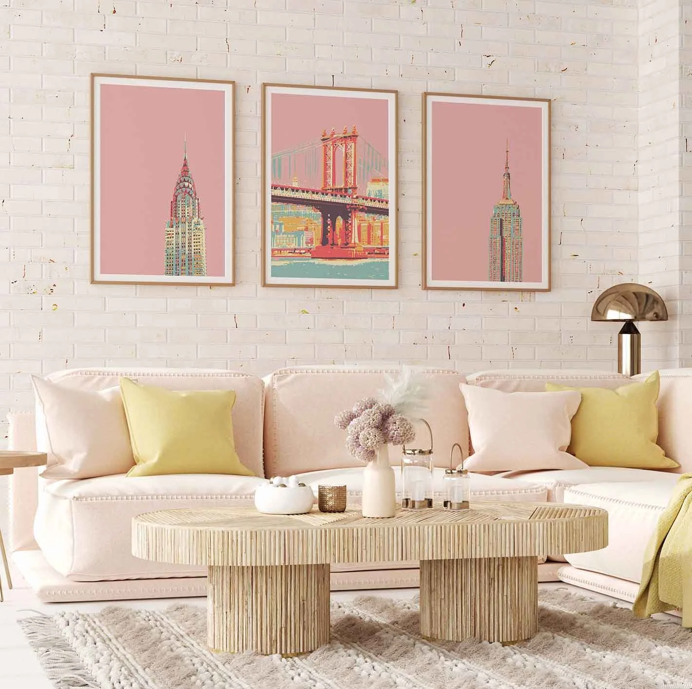 Frontal view of a boho living-room featuring 3 New York art prints in pink on the wall.