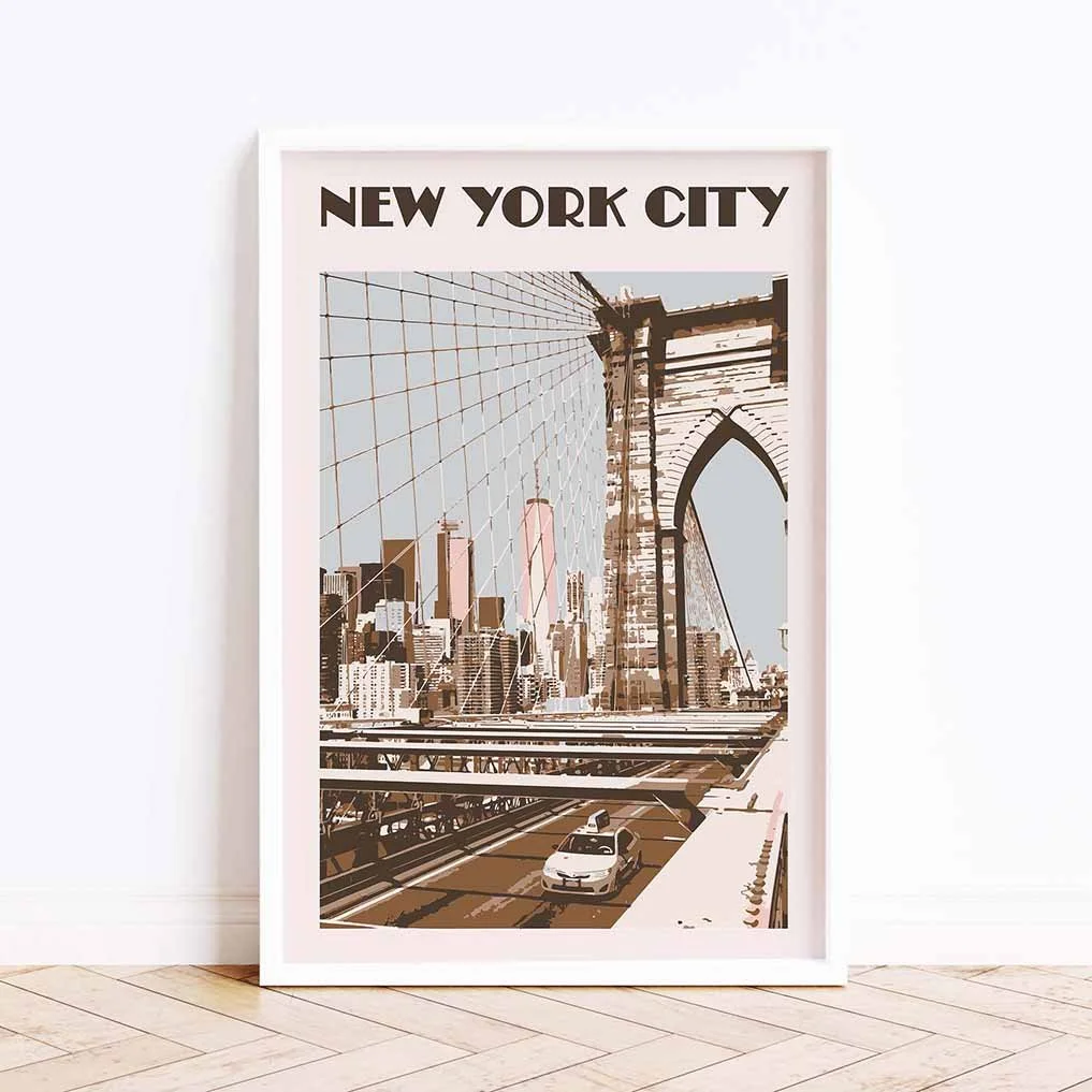 Framed New York City poster, in brown and pink tones, on the floor next to a white wall.
