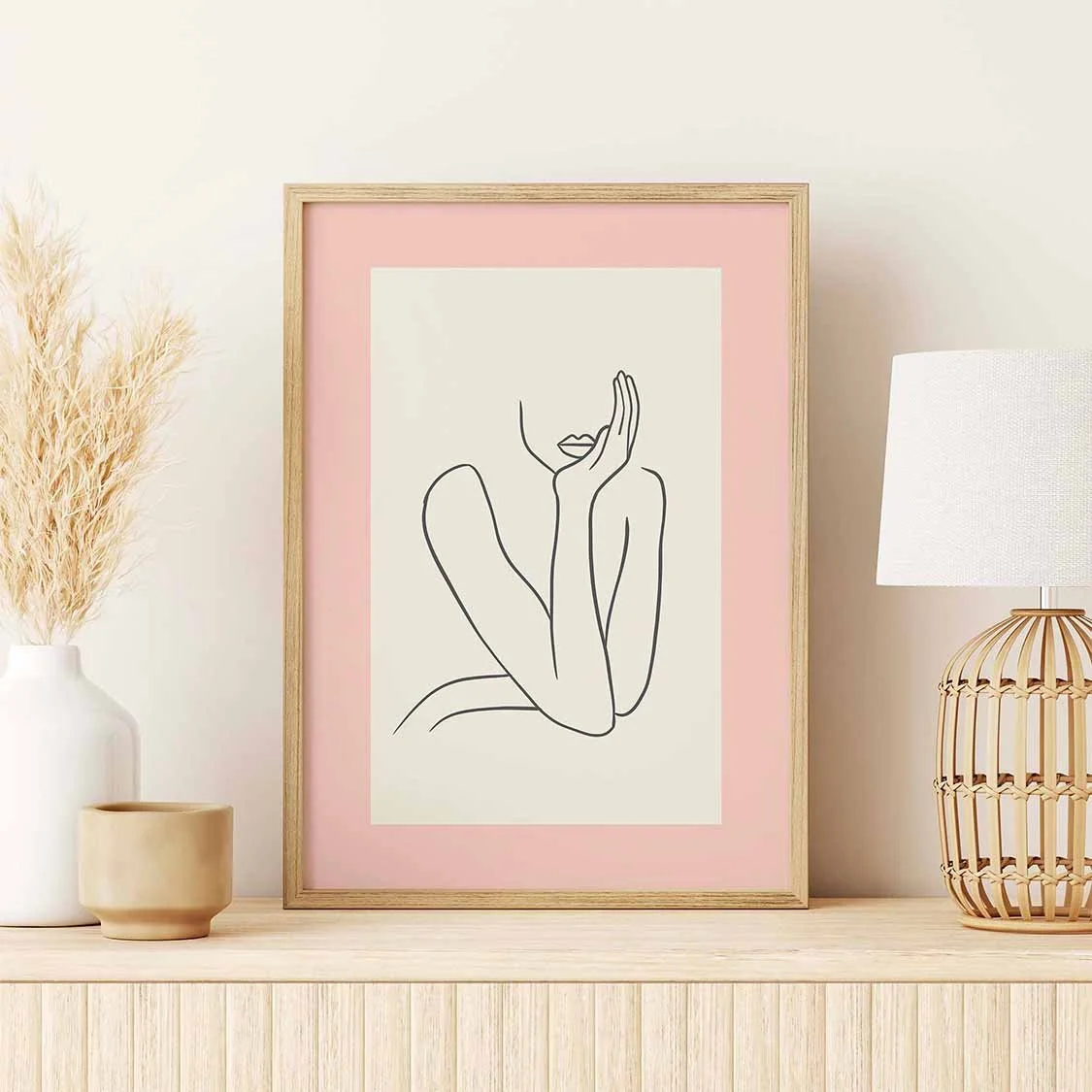 A framed art print featuring a female silhouette.