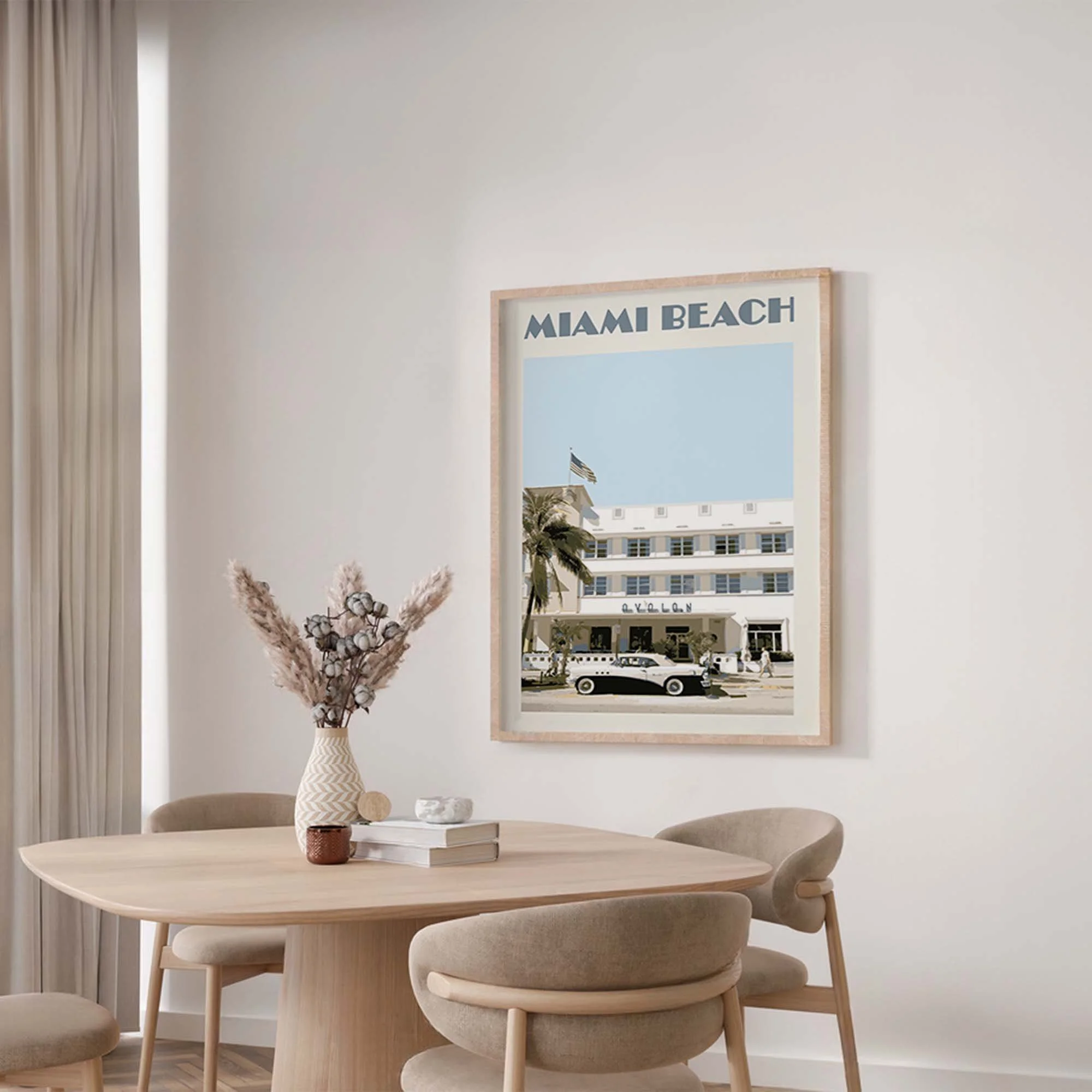 A Miami poster in shades of blue in a modern dining-room.