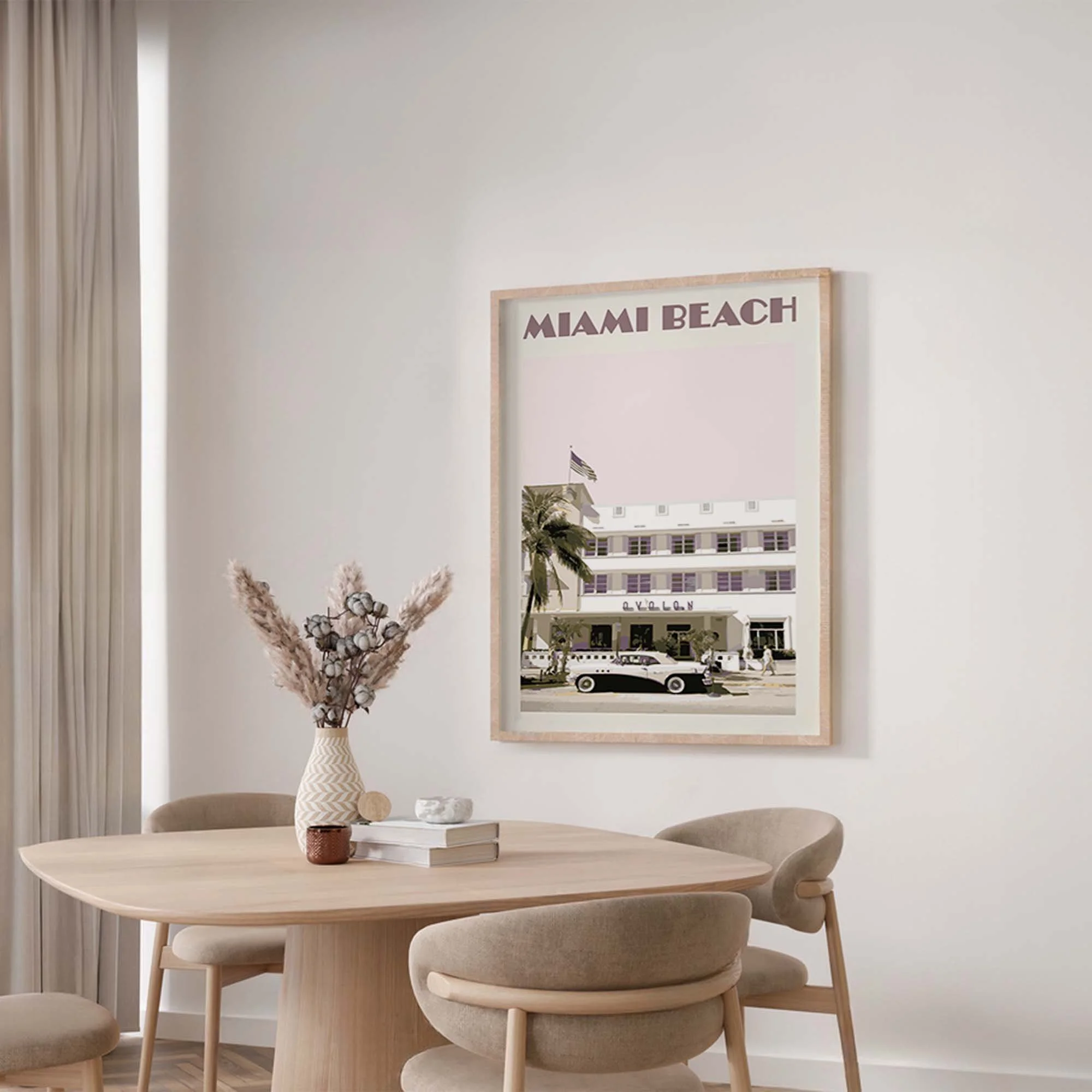 A Miami poster in shades of pink in a modern dining-room.