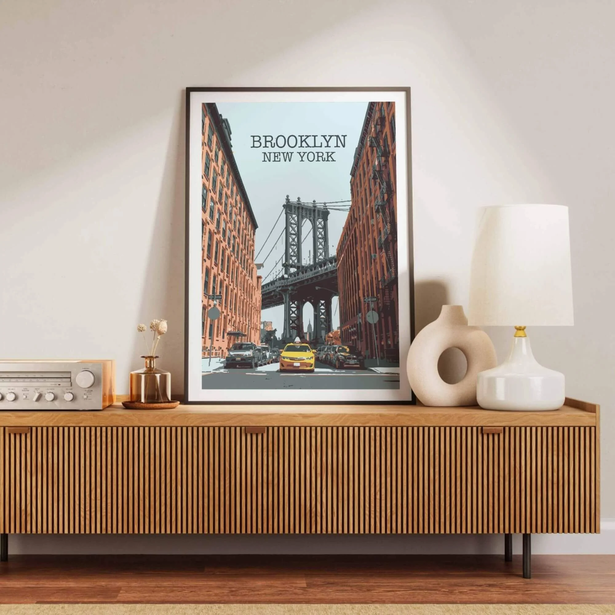 Graphic illustration of the Manhattan Bridge view from Washington Street, DUMBO, featuring red brick buildings and a yellow taxi in a vintage travel poster style.