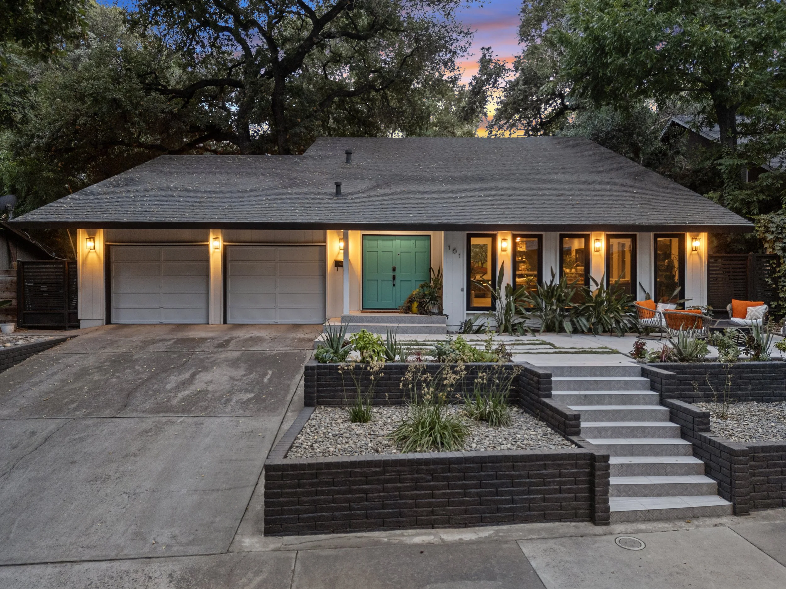 A twilight photo showing a home for sale in Modesto, California.