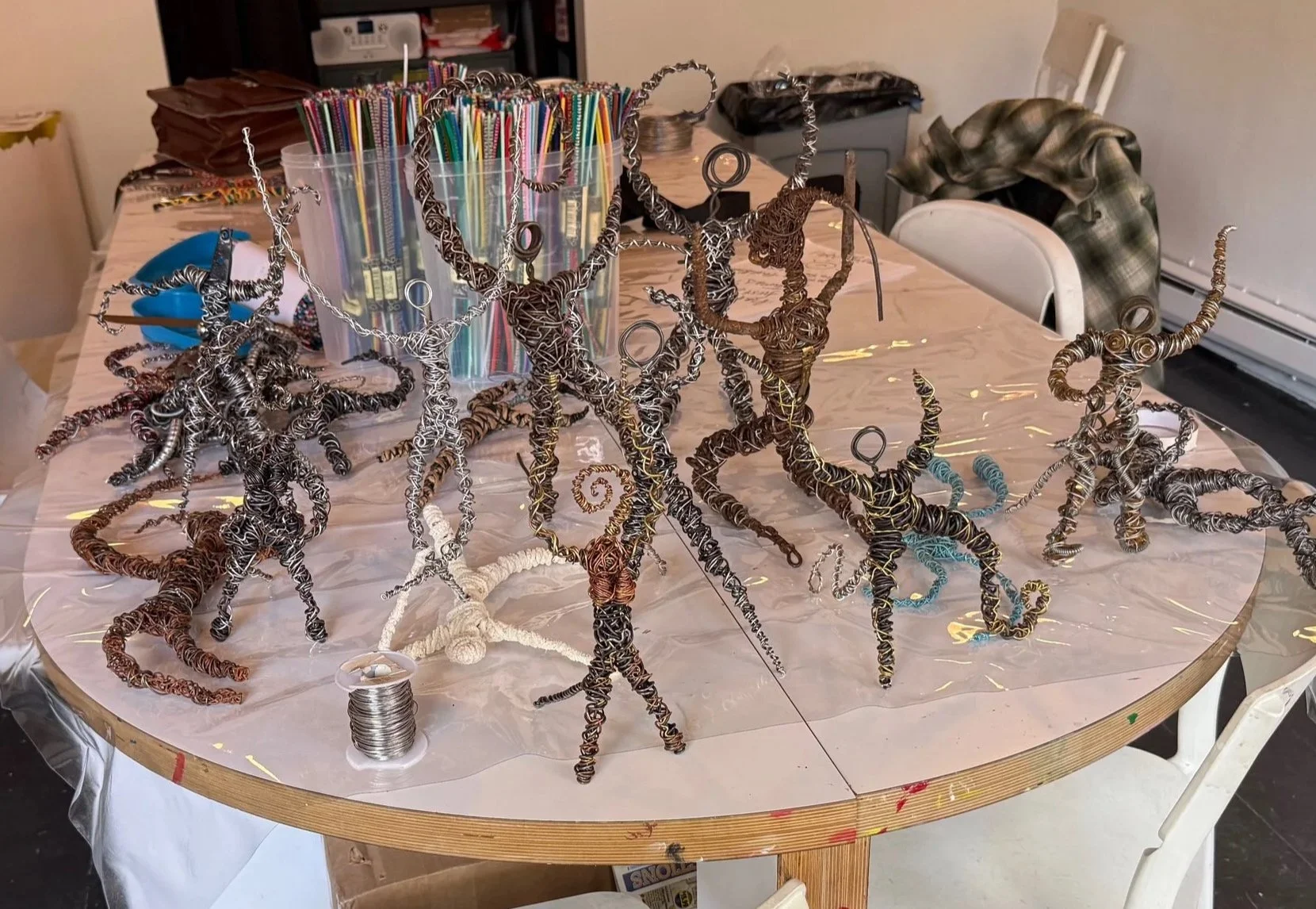A table full of sculptures, shipped here by my mother.