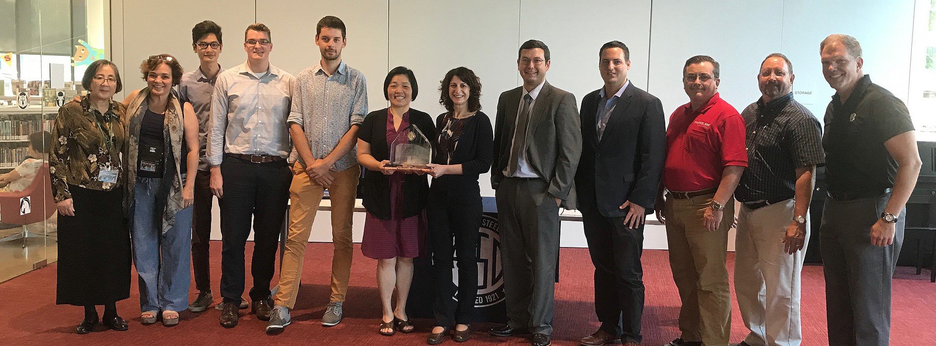 Chinatown Public Library Team receiving AISC IDEAS2 Award