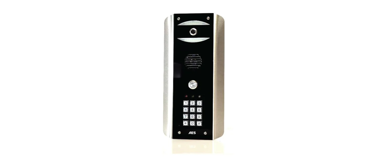 Intercom device with keypad and speaker on a white background.