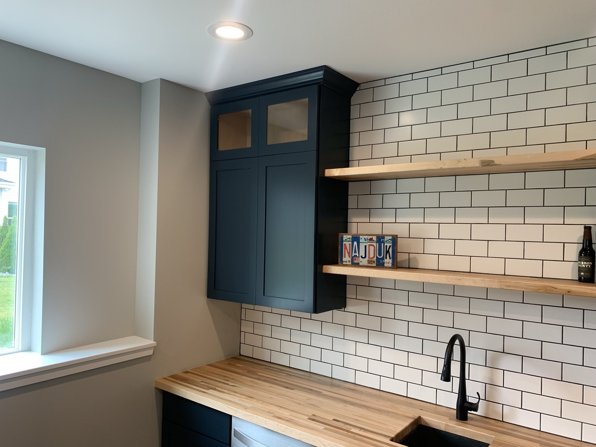 Built in shelves with subway tile