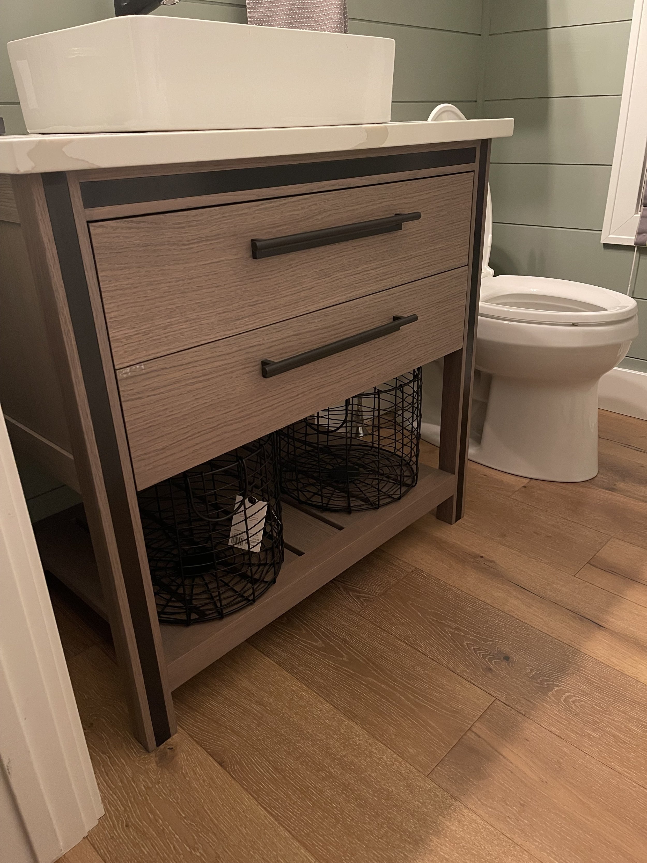 Custom wooden bathroom vanity and baskets