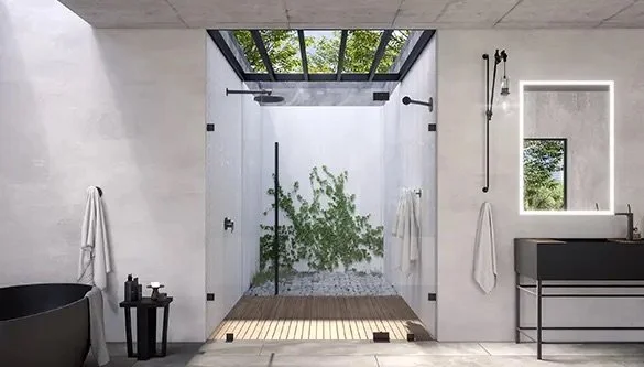 Modern bathroom with walk-in shower, glass door, and outdoor garden view.