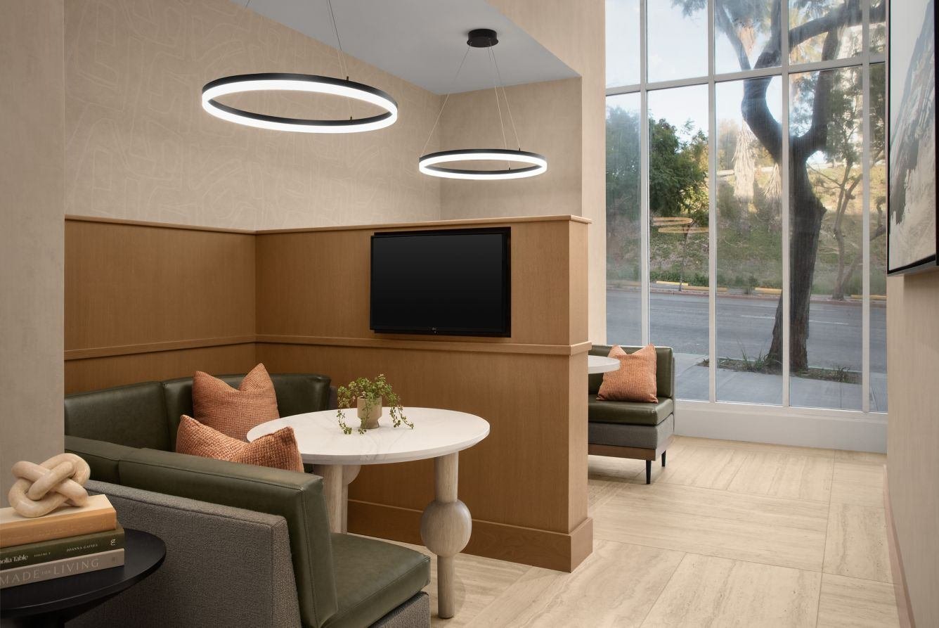 Clean lines, warm wood tones, and a cozy built-in moment.

Millwork that brings function and comfort together in a simple, elevated way.
.
.
.
#custommillwork #hospitalitydesign #interiordesign #builtinseating #millworkdetails #commercialinteriors