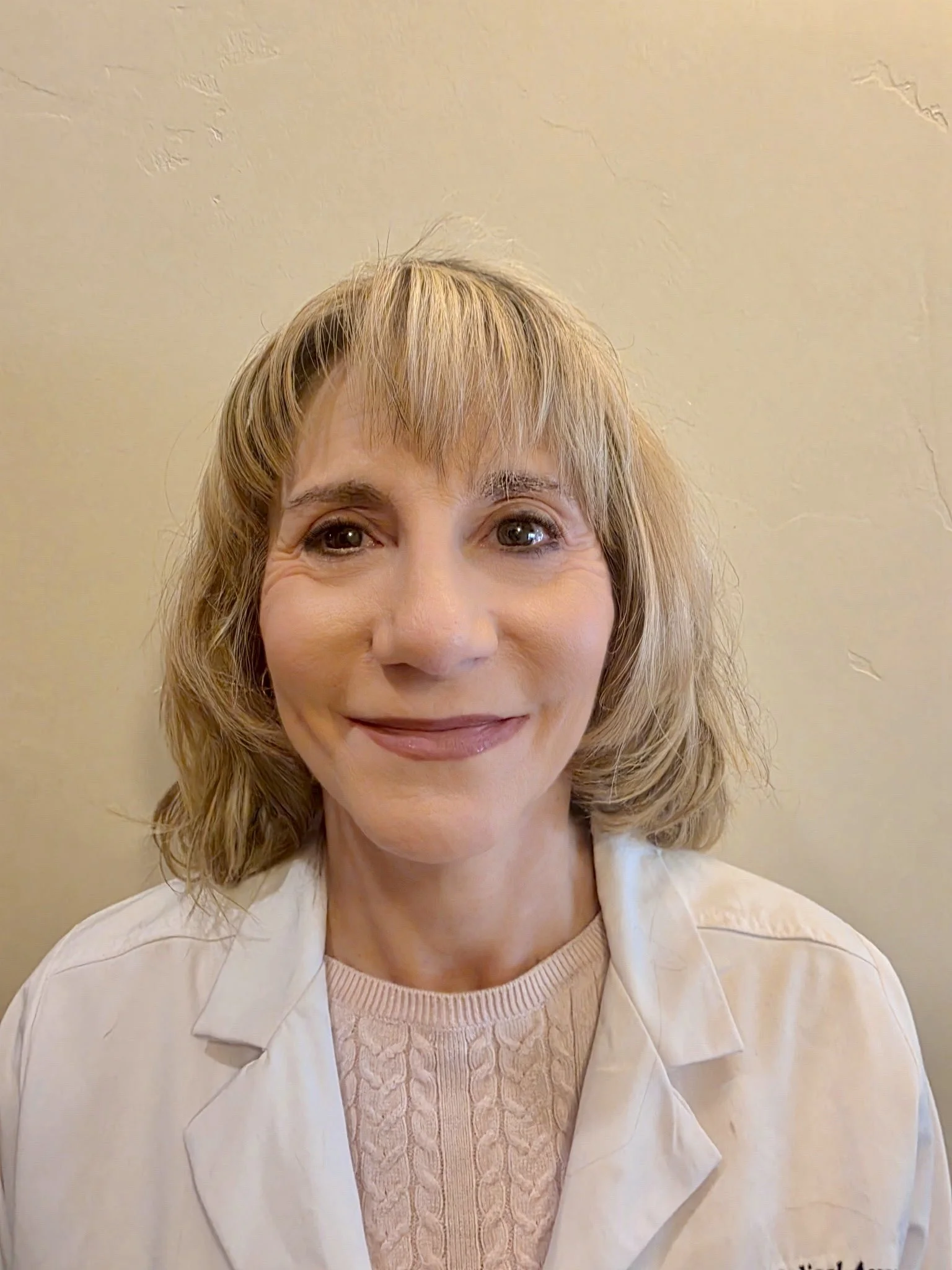 Portrait of Dr Maria Raslear smiling.