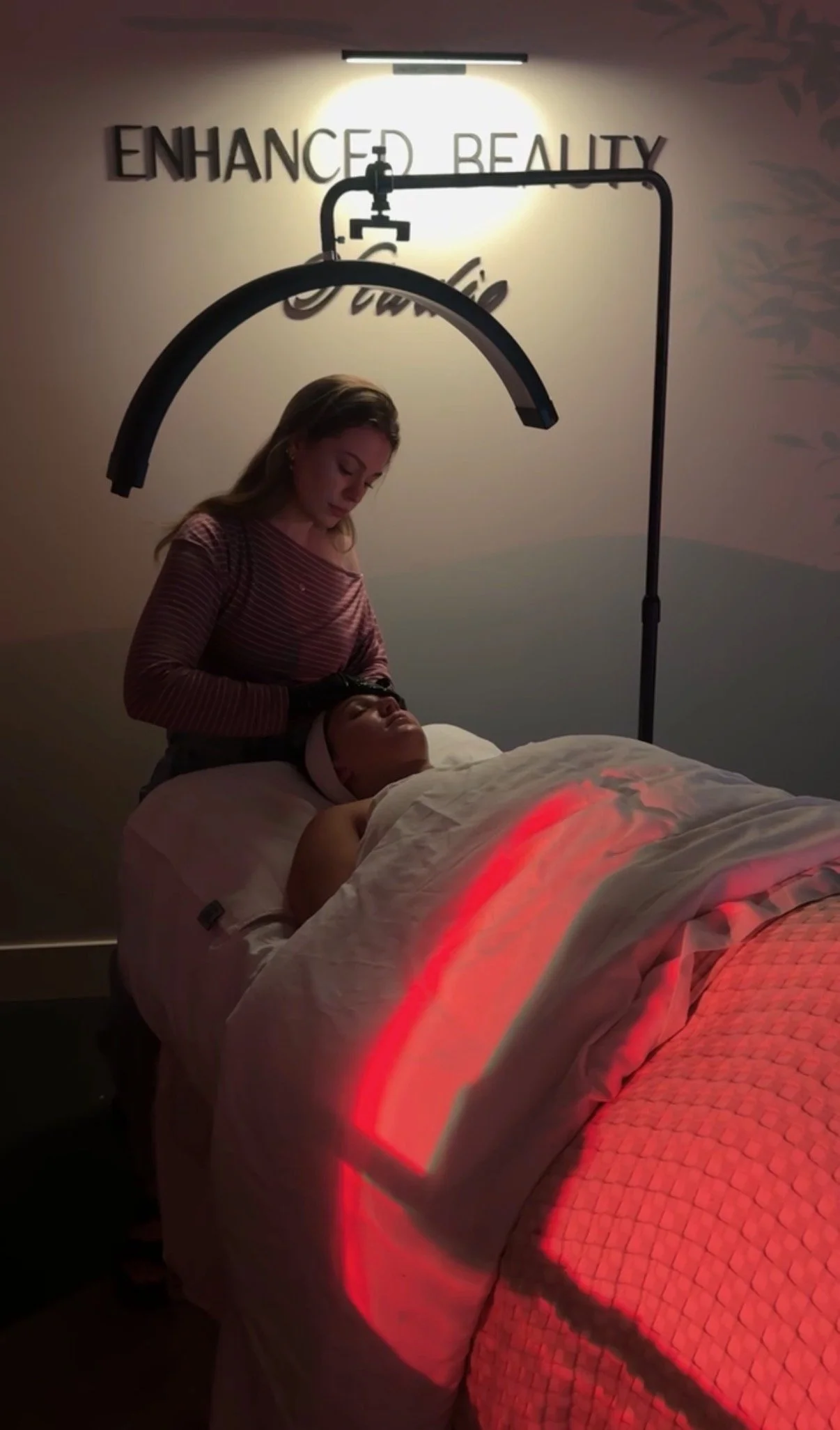 female esthetician performing a custom facial in a luxury treatment room