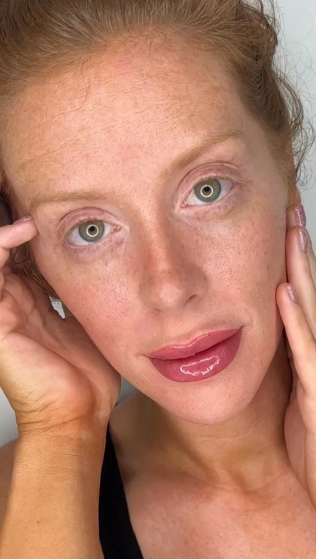 female with fresh lip blushing in a natural pink tone and glossy lips