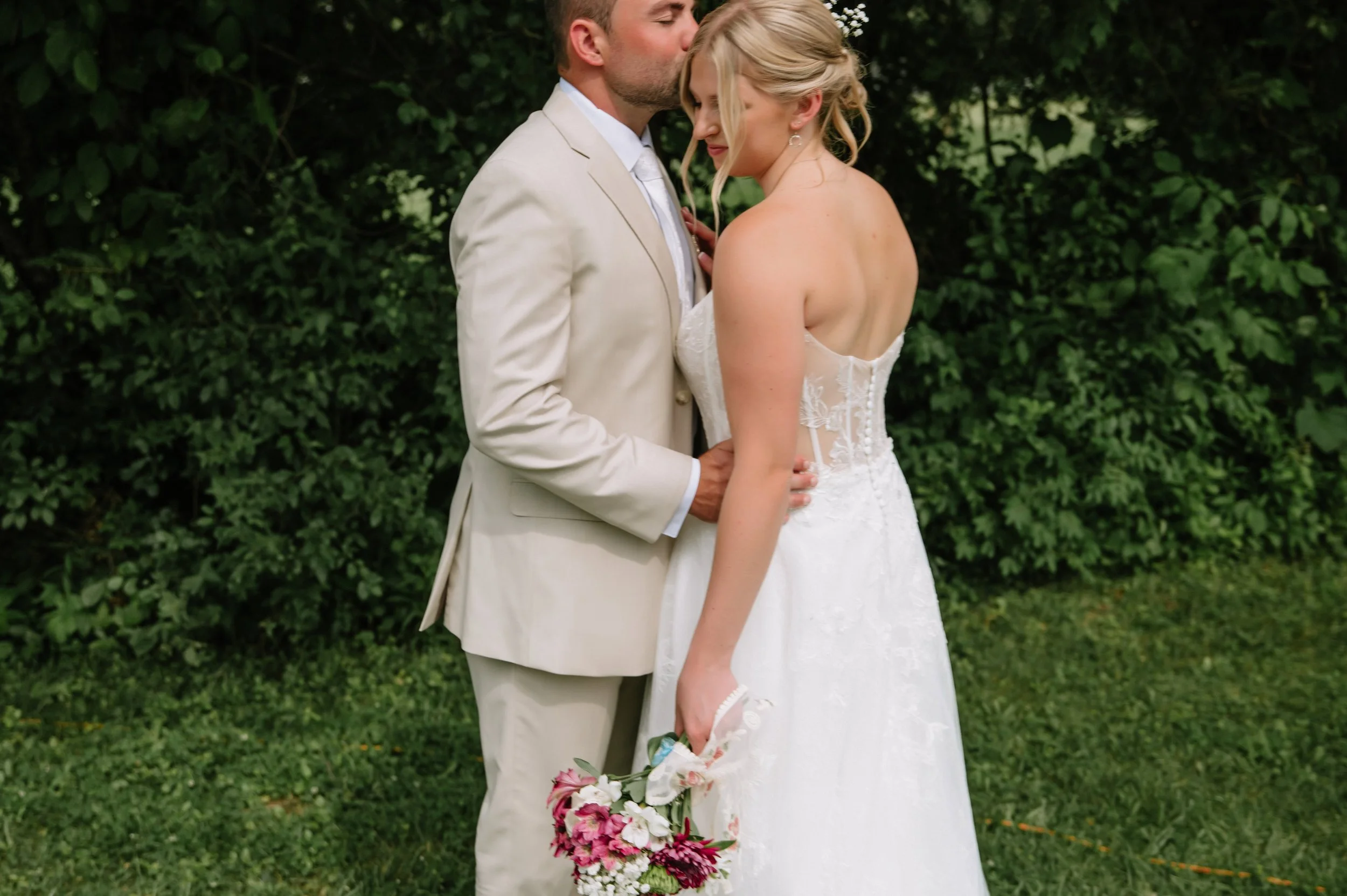 groom kissing bride.jpg