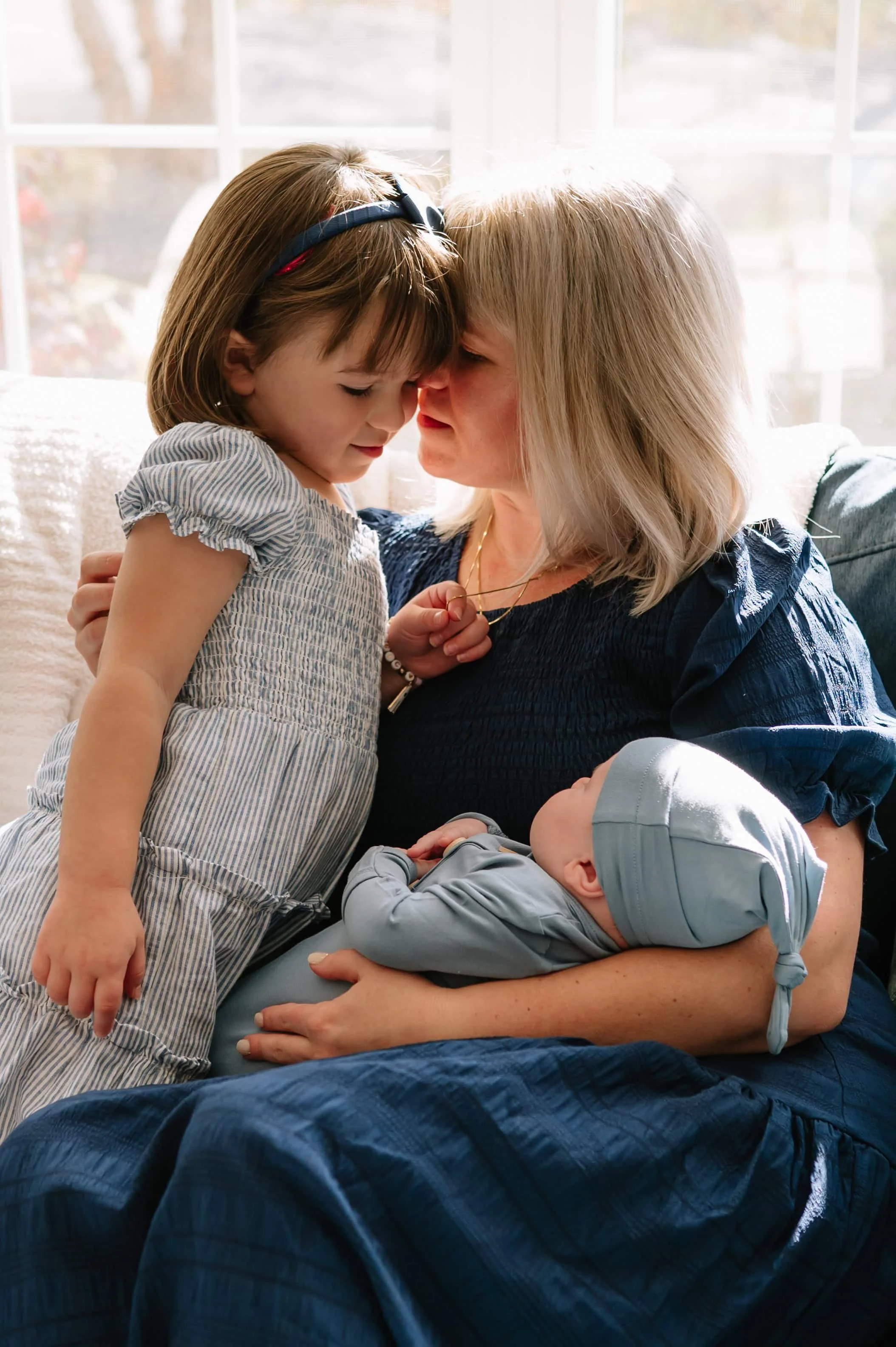 mom holding kids during photoshoot