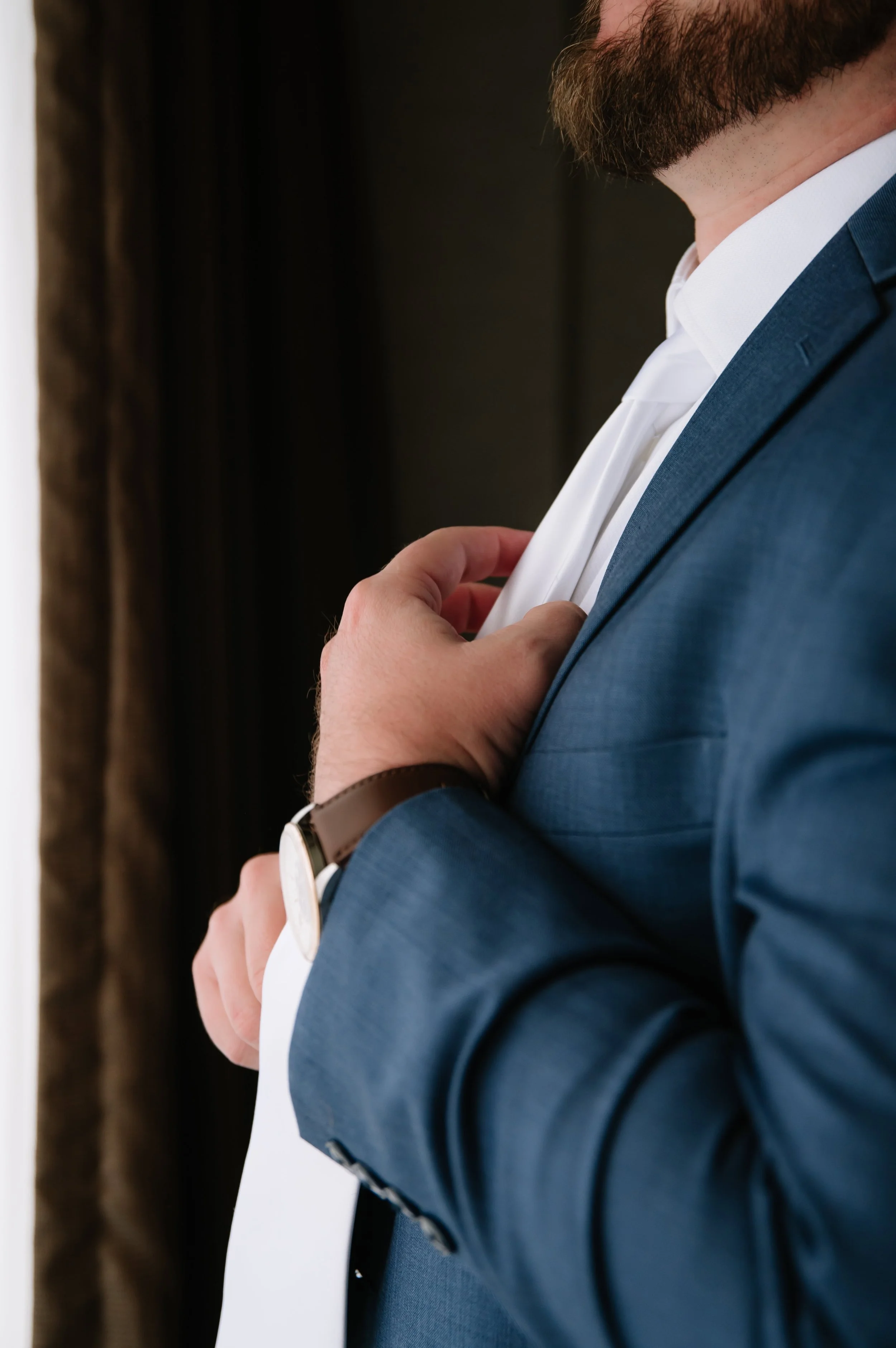 groom getting ready before wedding ceremony