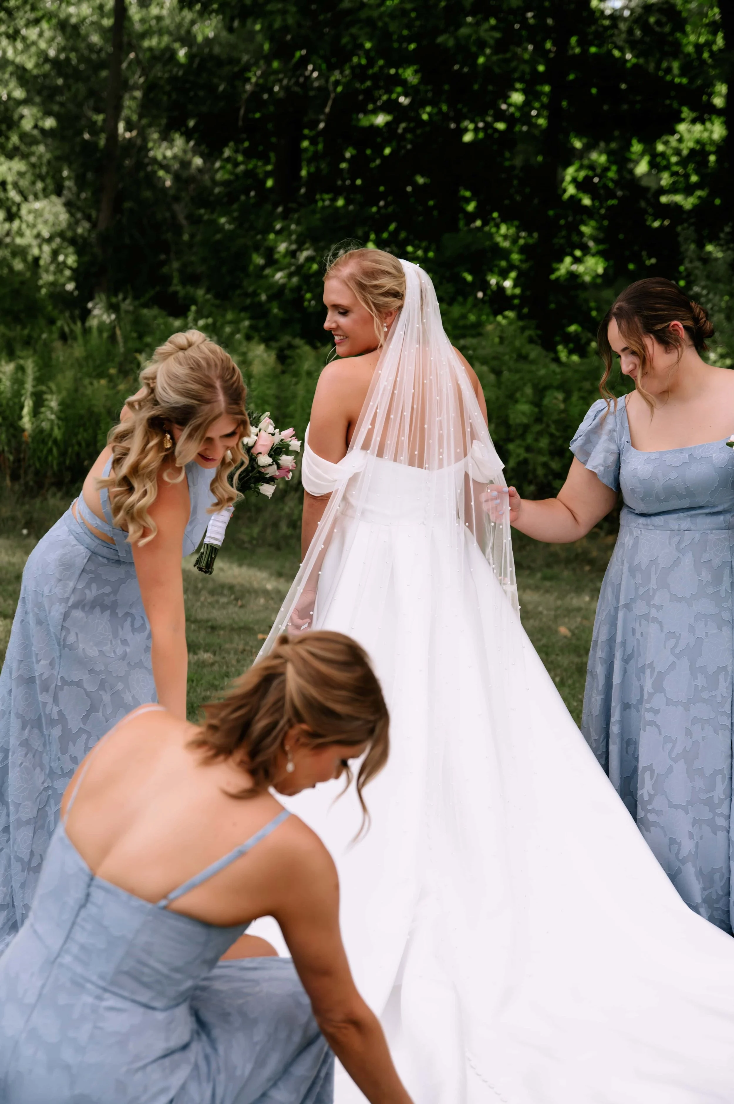 bridesmaids straightening dress