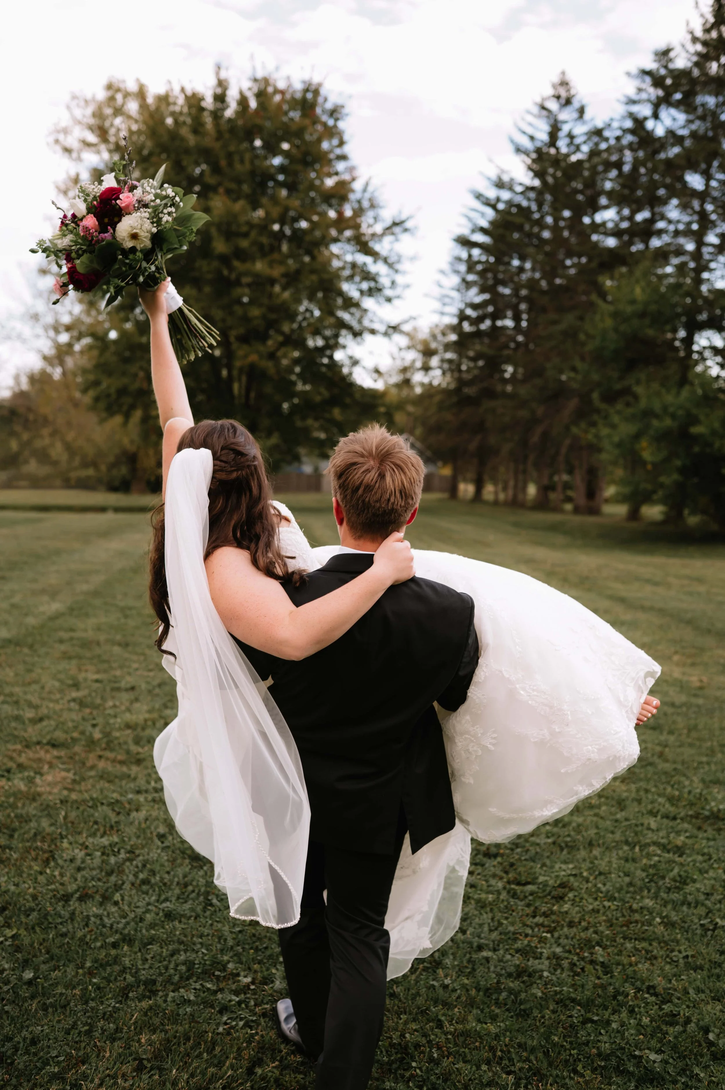 groom carrying bride.jpg