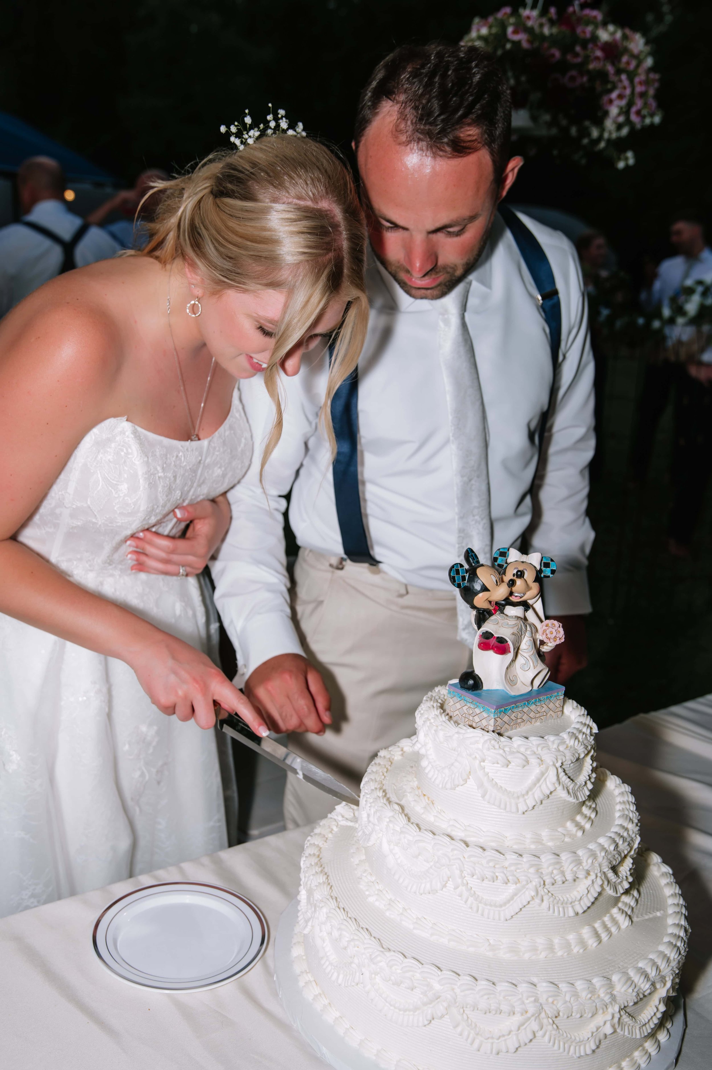 couple cutting wedding cake.jpg