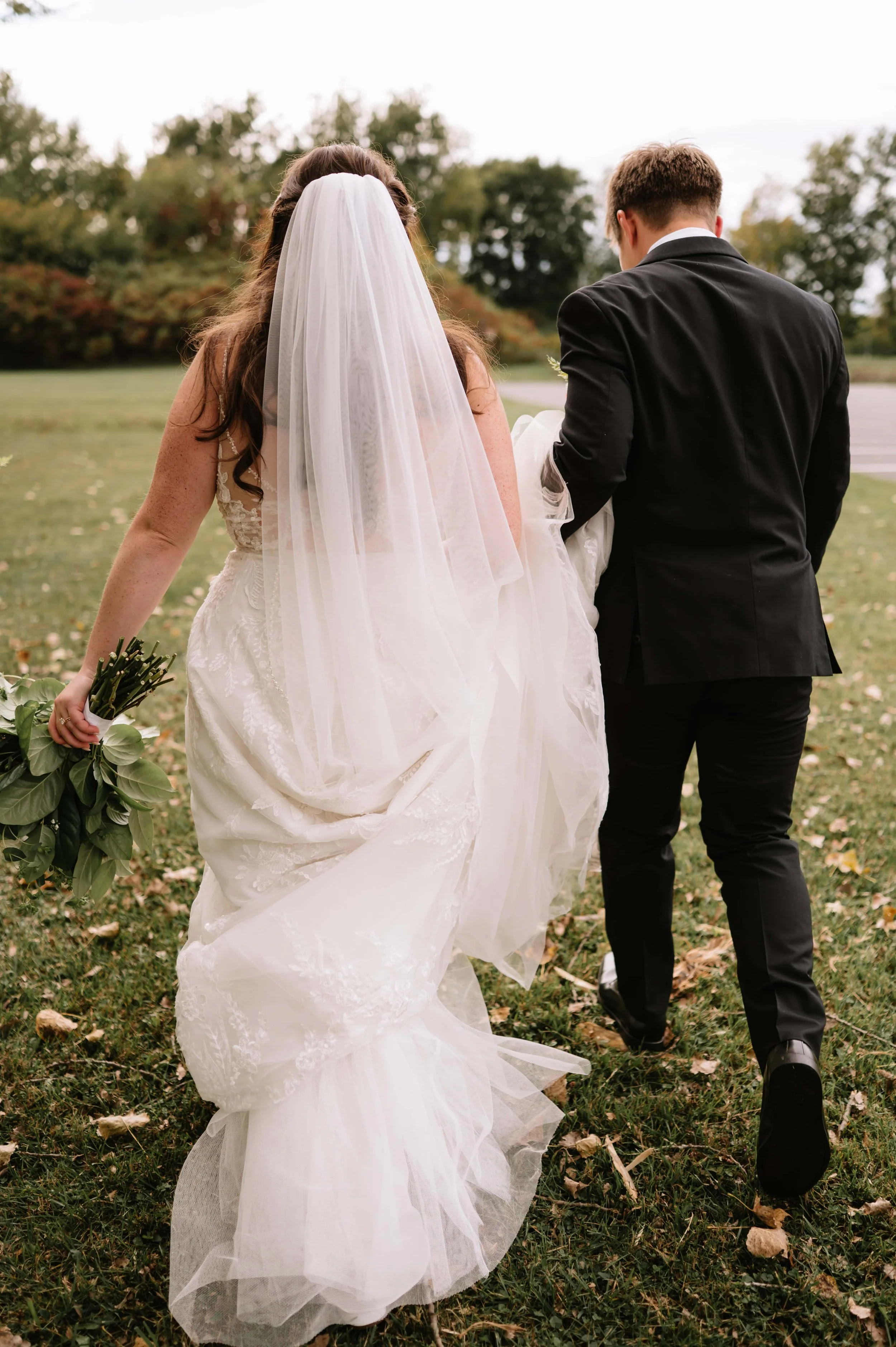 bride and groom walking.jpg