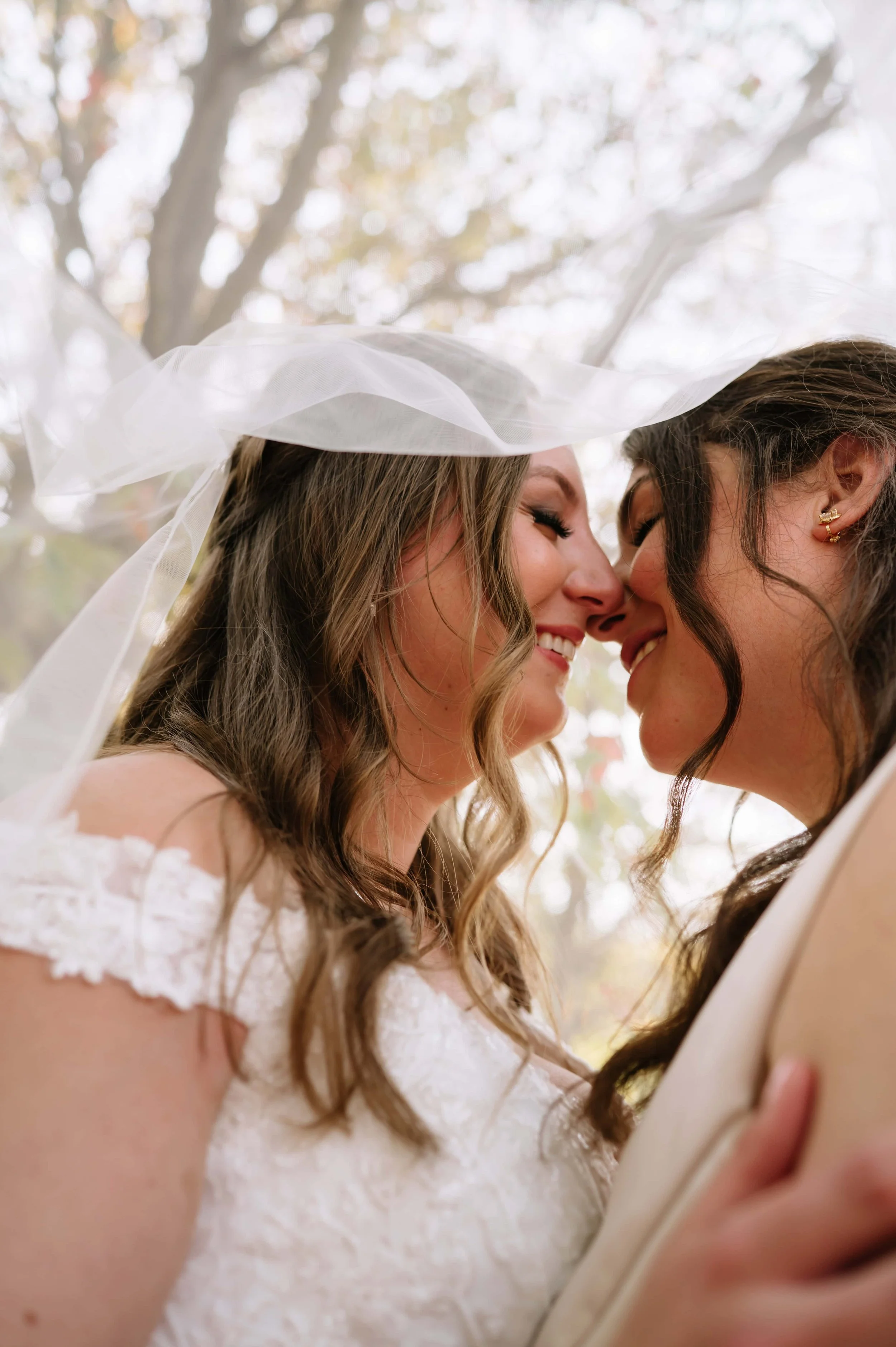 brides smiling at each other.jpg