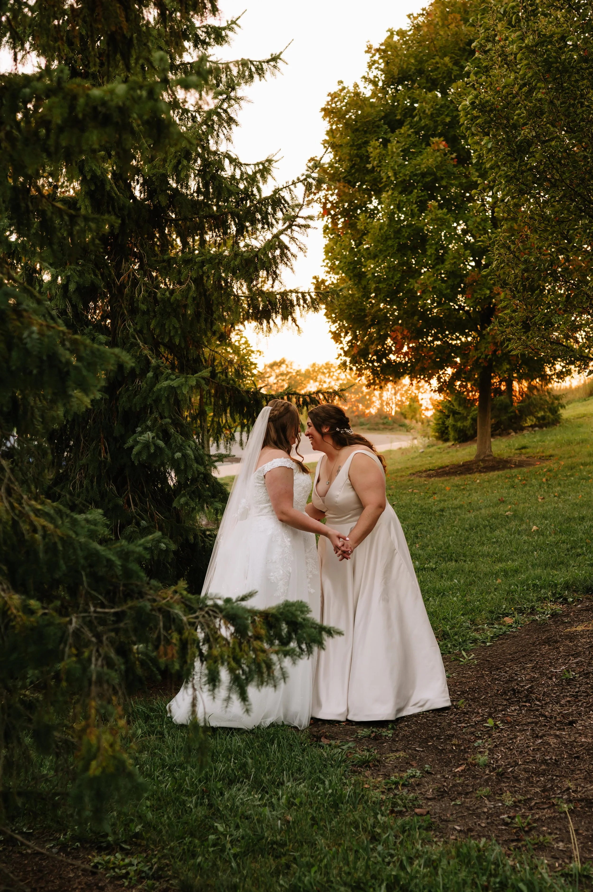 brides laughing in garden.jpg