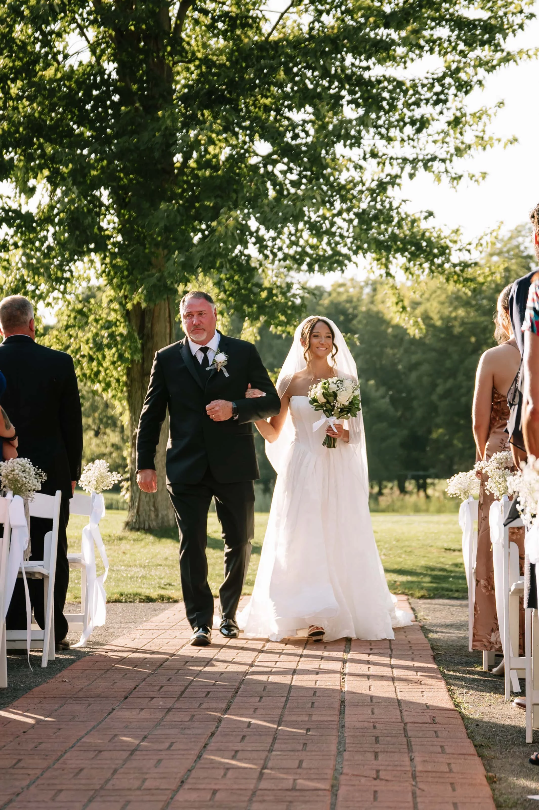 bride walking down aisle with her father.jpg