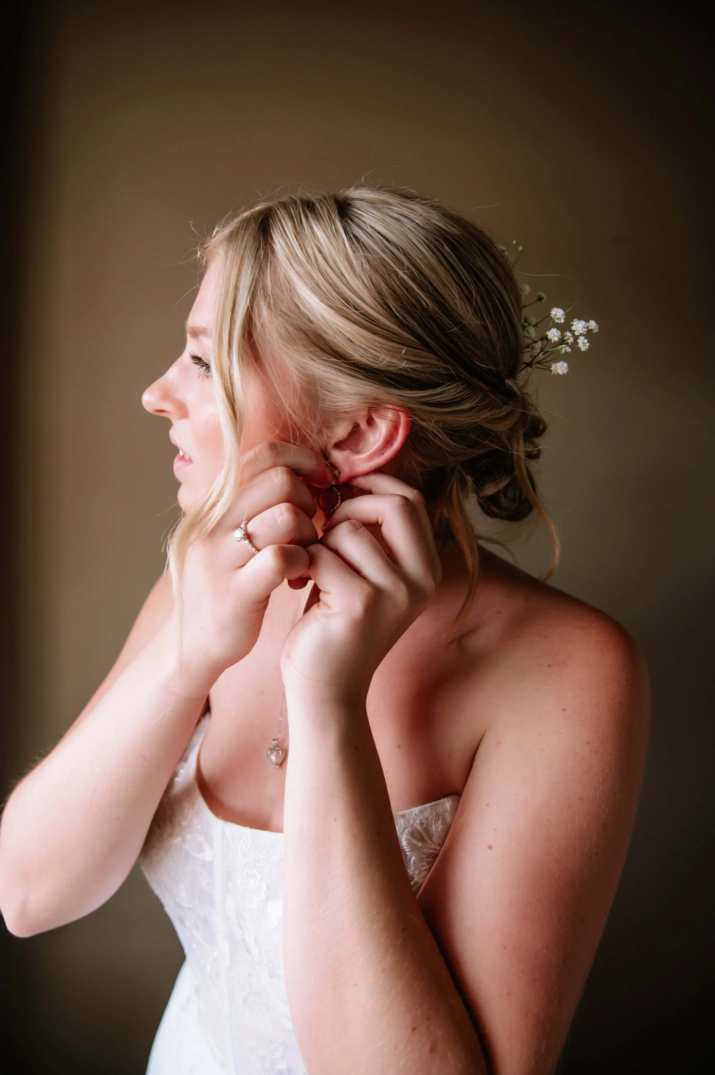 bride putting on earrings.jpg