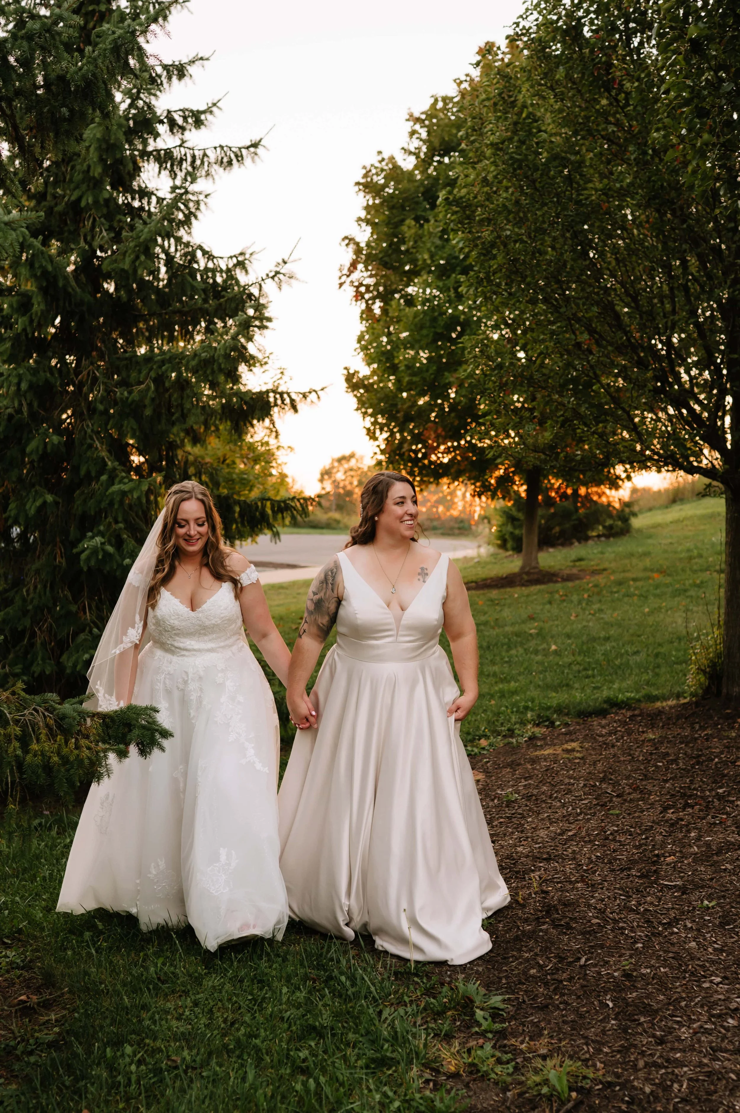 brides walking at sunset.jpg