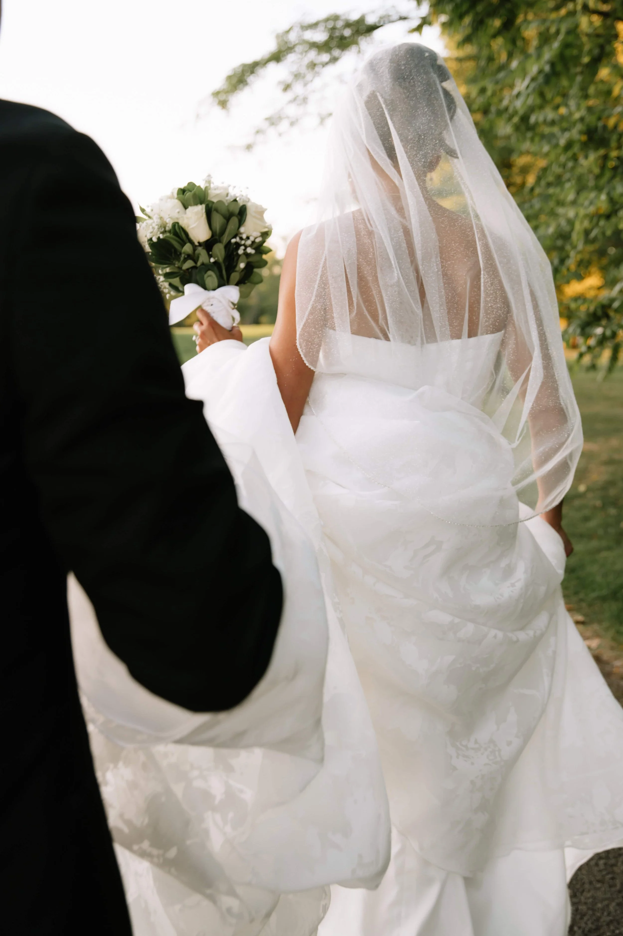groom carrying dress.jpg
