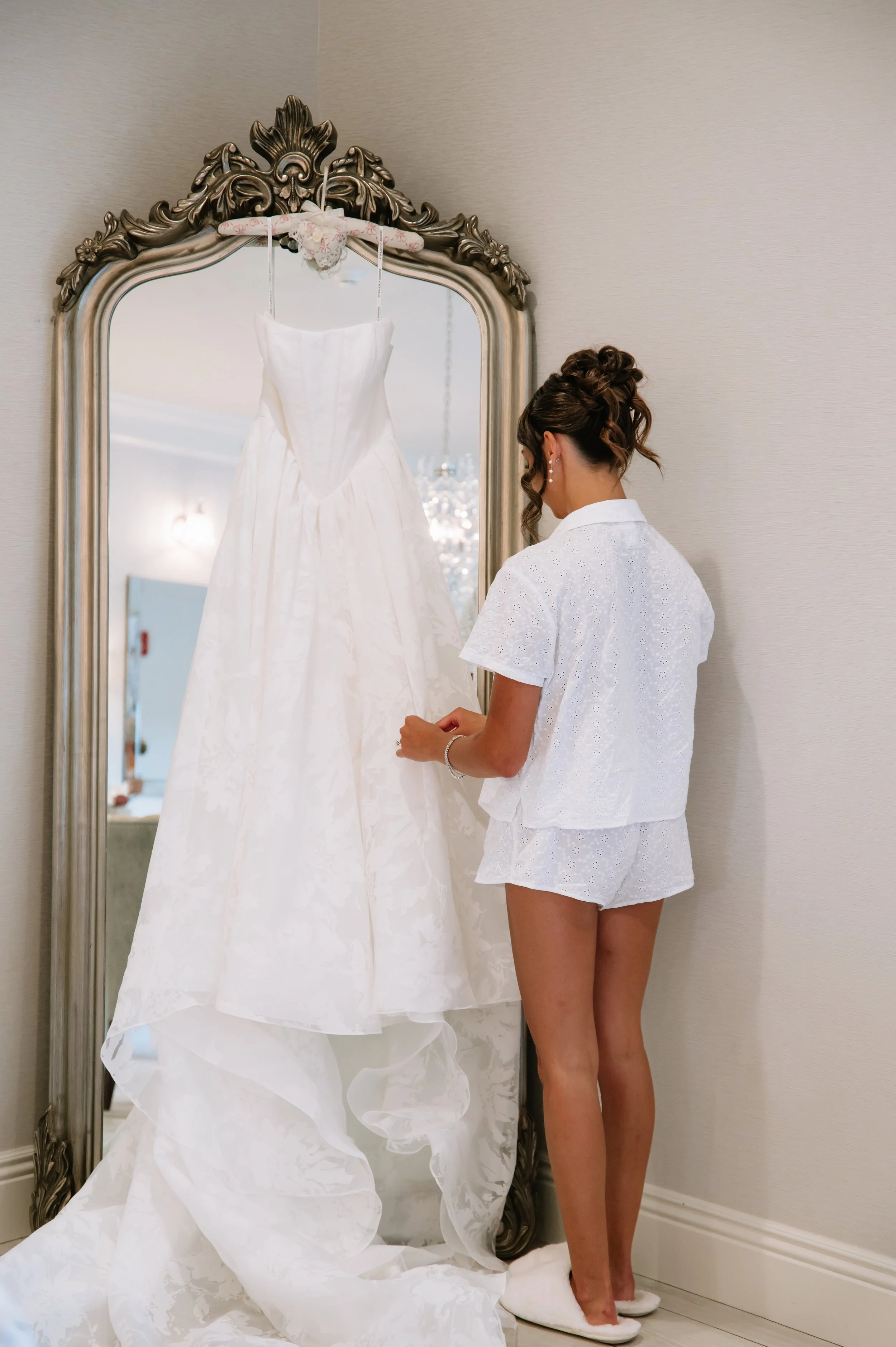 bride looking at wedding dress.jpg