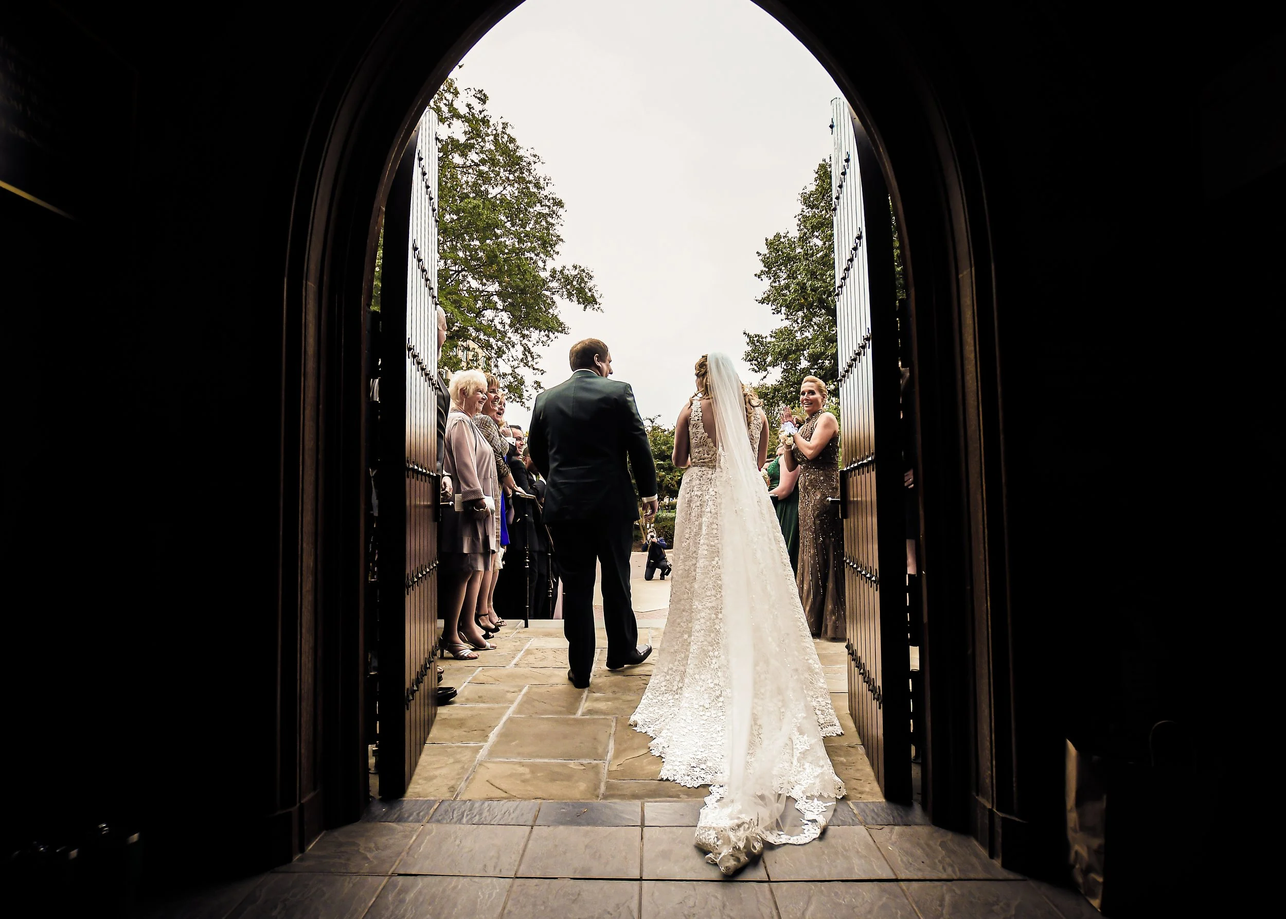 Captured from behind, the newlyweds step out of the church—joy radiates in every stride as they begin their new journey together.
A timeless New York wedding moment—love, celebration, and the promise of a shared adventure.