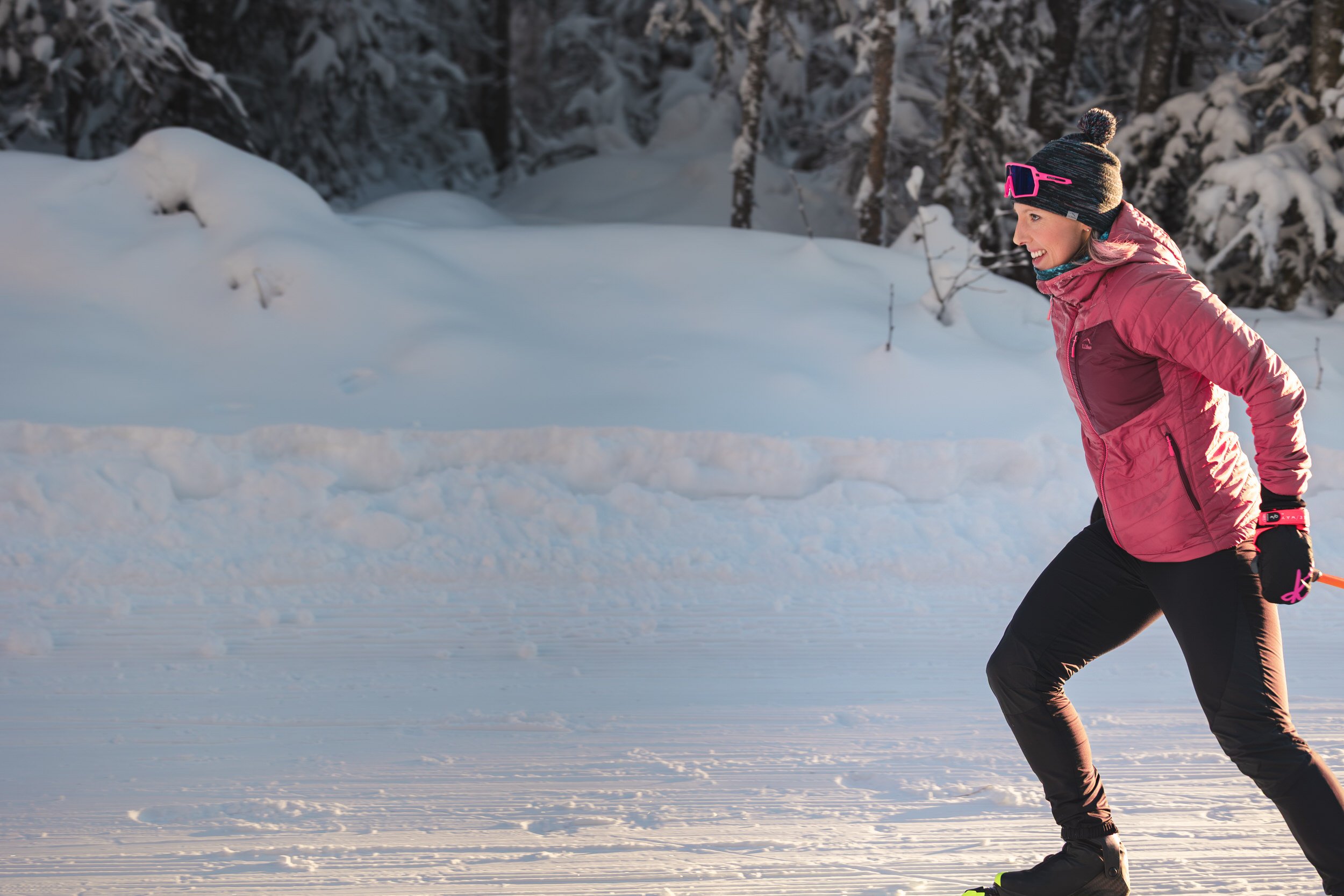 Olympic gold medalist Kikkan Randall cross-country skiing during GCI's Super Bowl commercial photography campaign, photographed by Alaska commercial photographer Lena Lee.