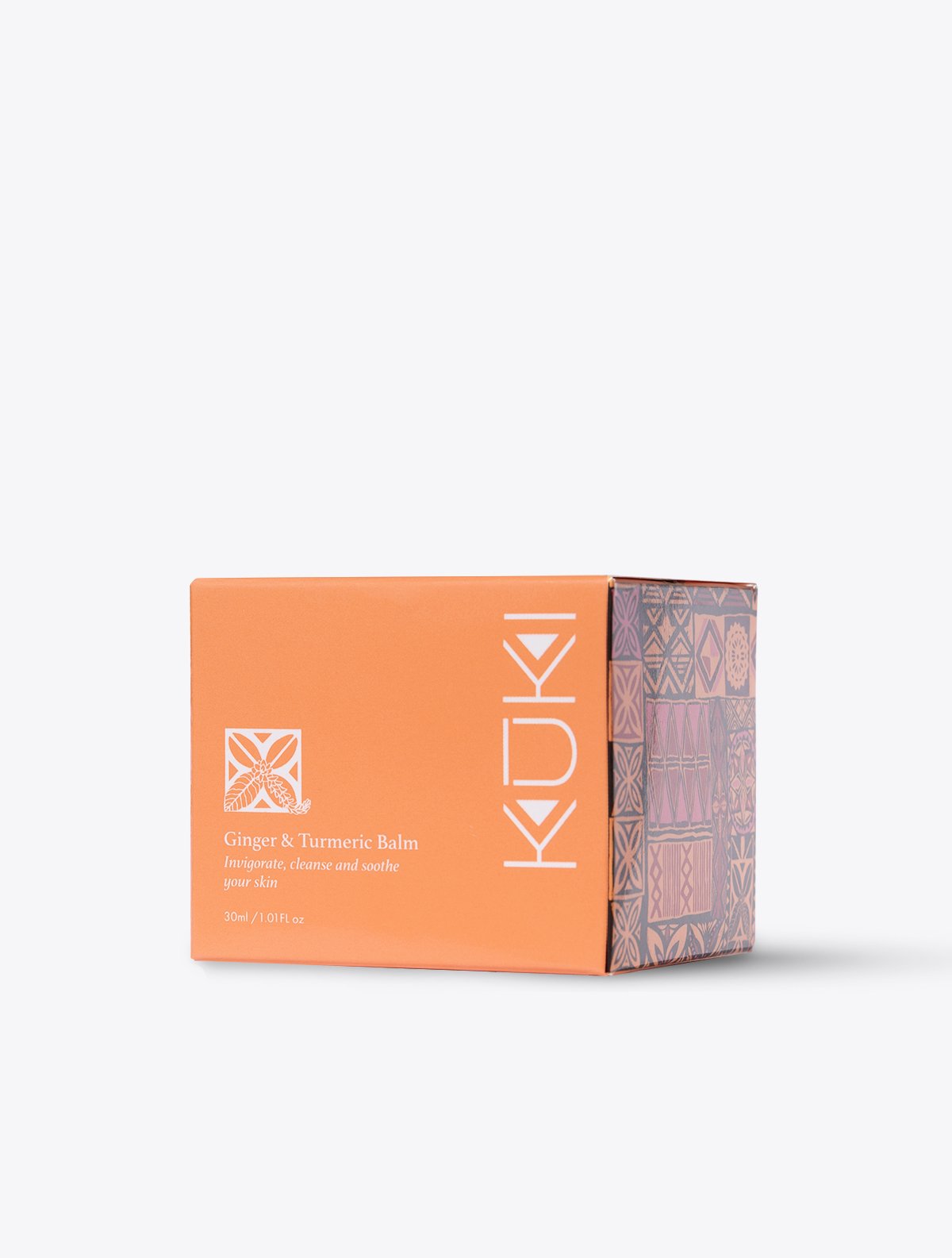 Orange box labeled "KUKI Ginger & Turmeric Balm" with decorative patterns on side.