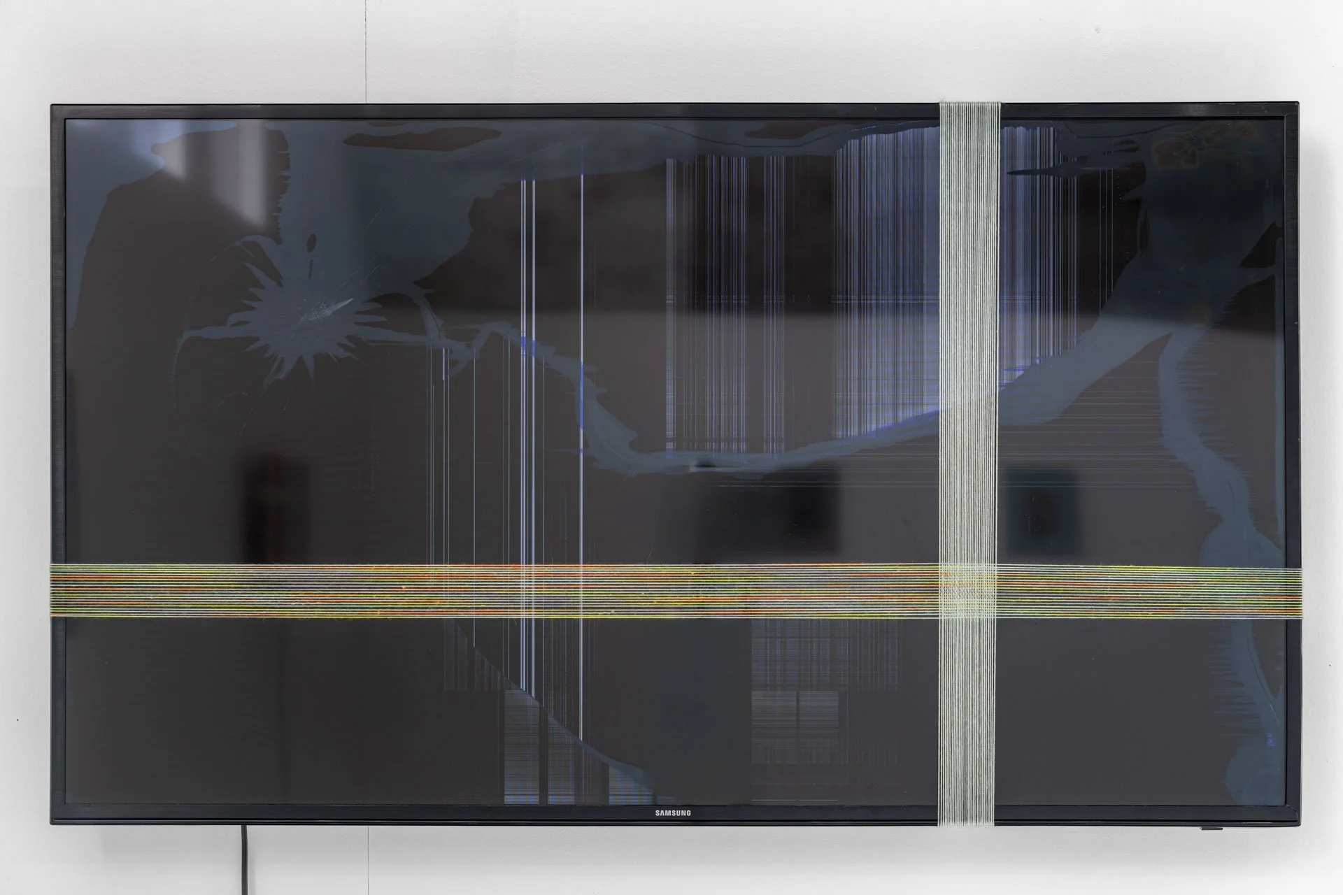 'TV no.3', 2026, broken liquid crystal display, cotton, wool, 61 x 108 x 20 cm